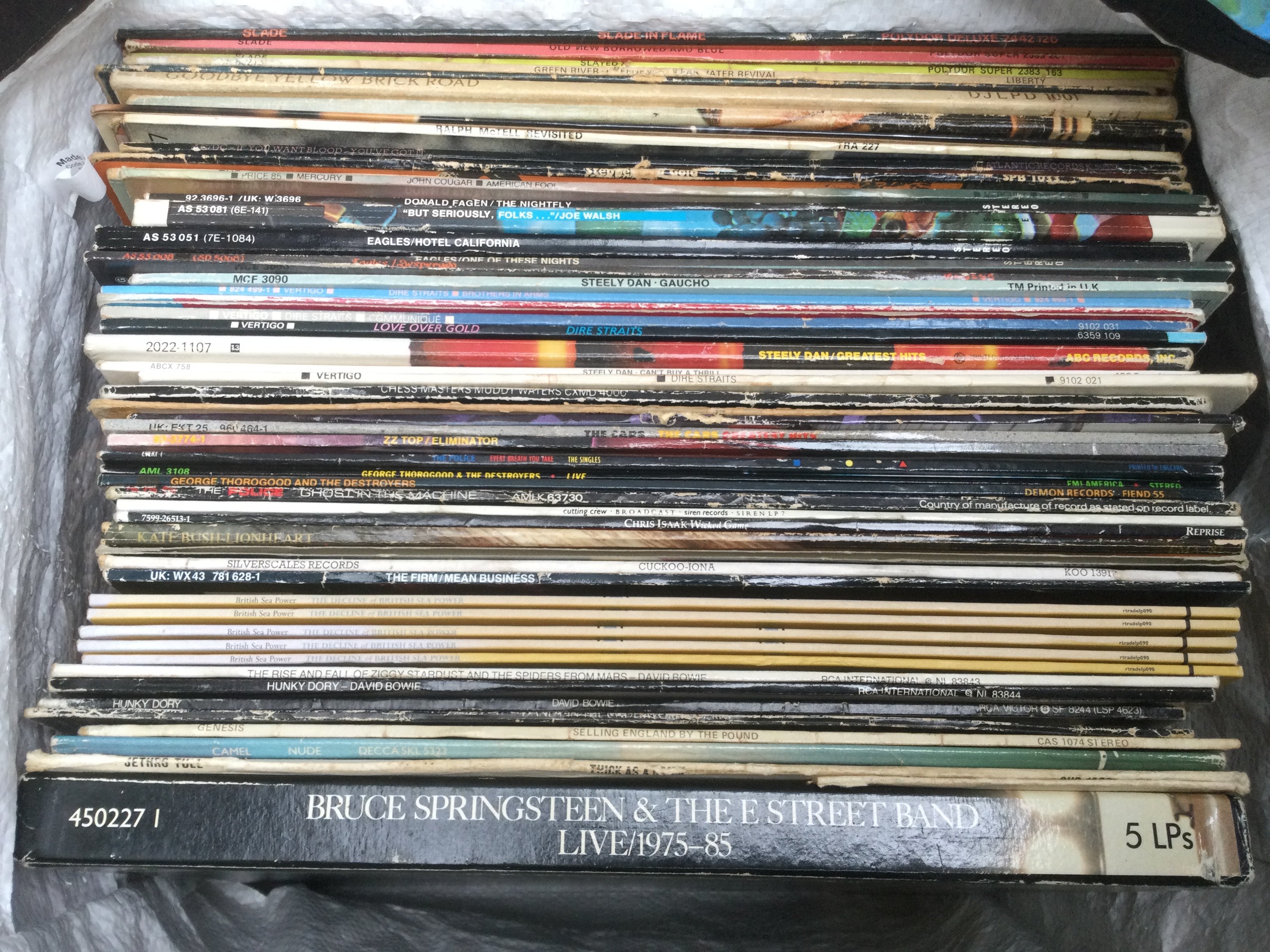 A collection of LPs by various artists including Bruce Springsteen, Kate Bush, British Sea Power and others.