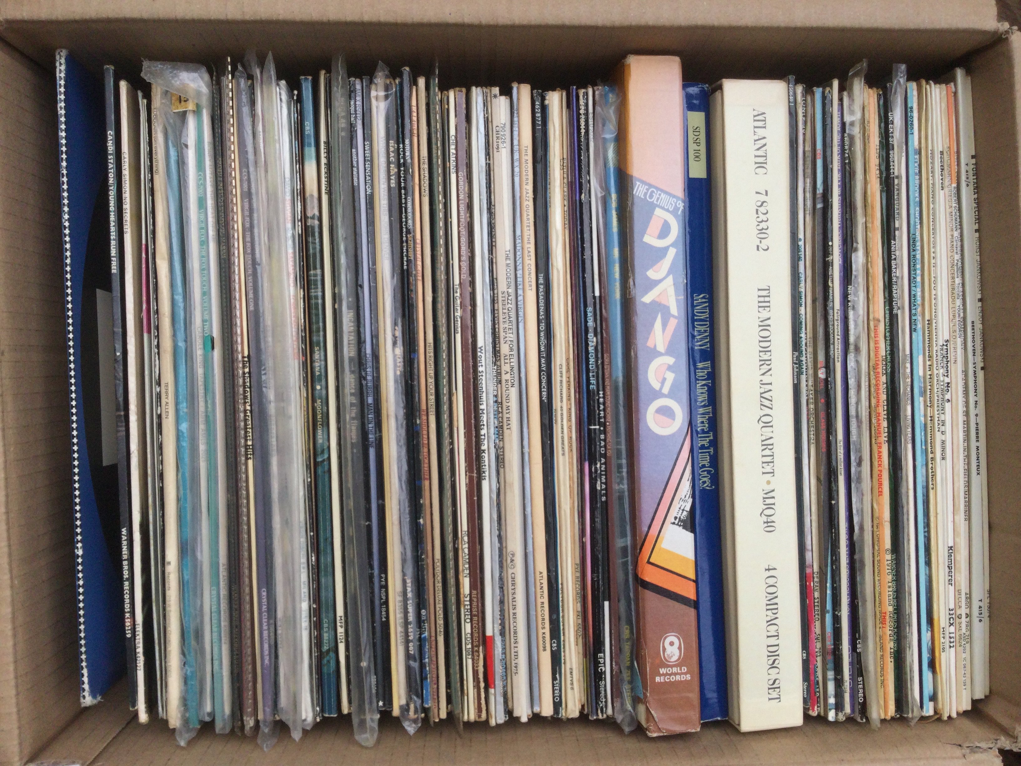 Two boxes of LPs, 12" and 7" singles by various artists plus a John Lennon Anthology multi CD box set.