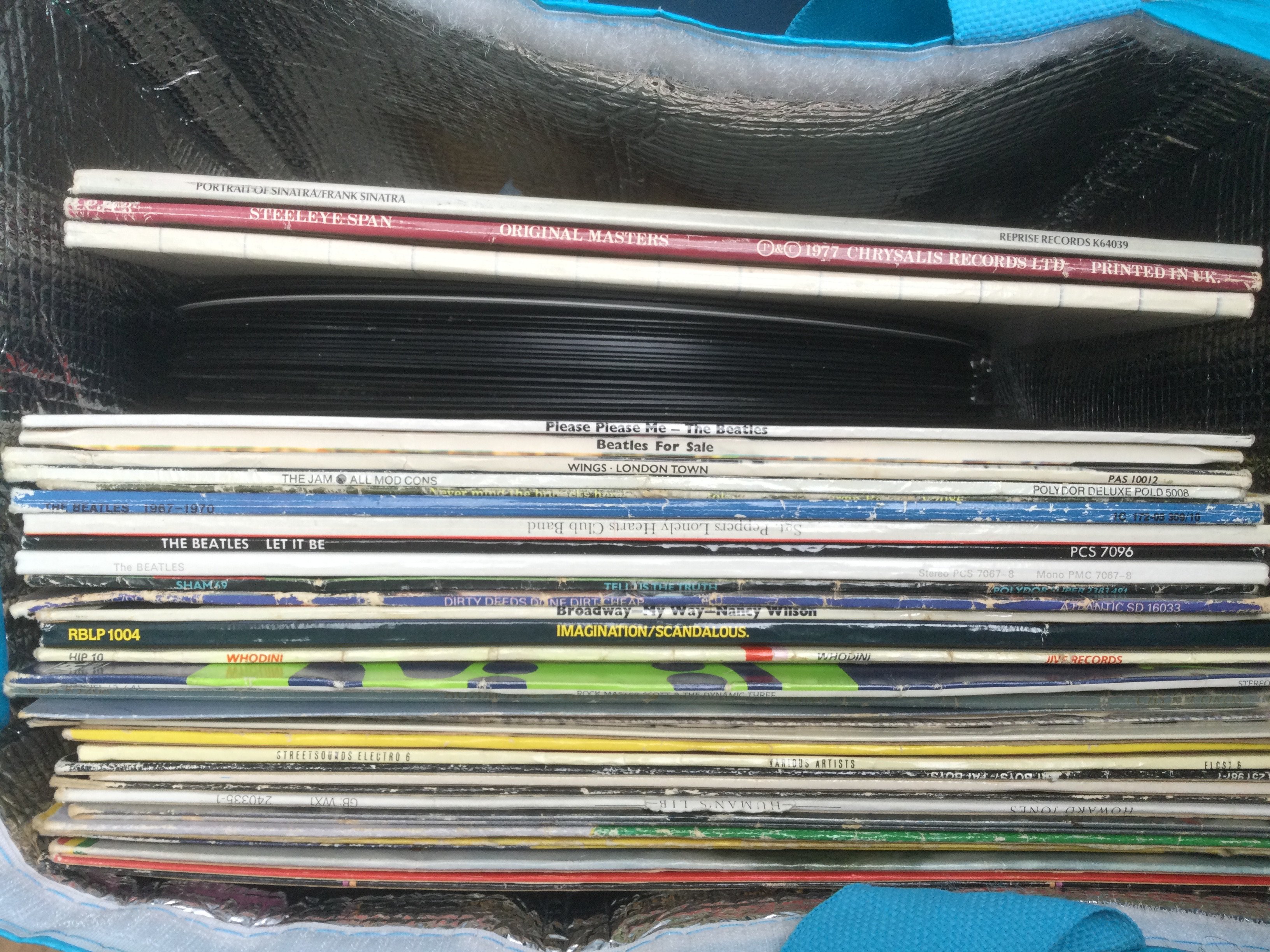 A collection of LPs and 12" singles plus spare covers. Artists include The Beatles, Pink Floyd, Sex Pistols and others. Some condition issues.