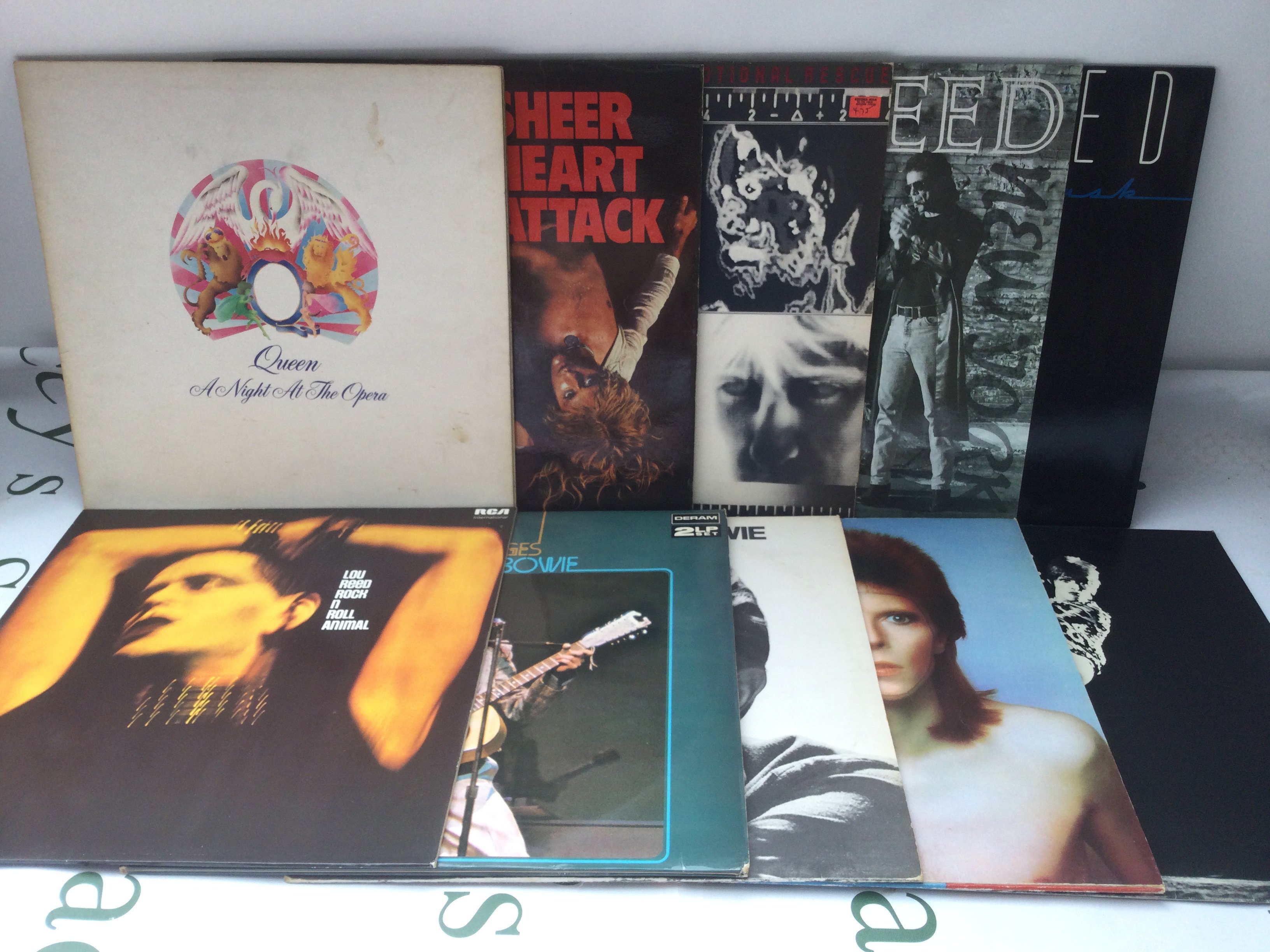Ten LPs by Queen, David Bowie, Rolling Stones and Lou Reed.