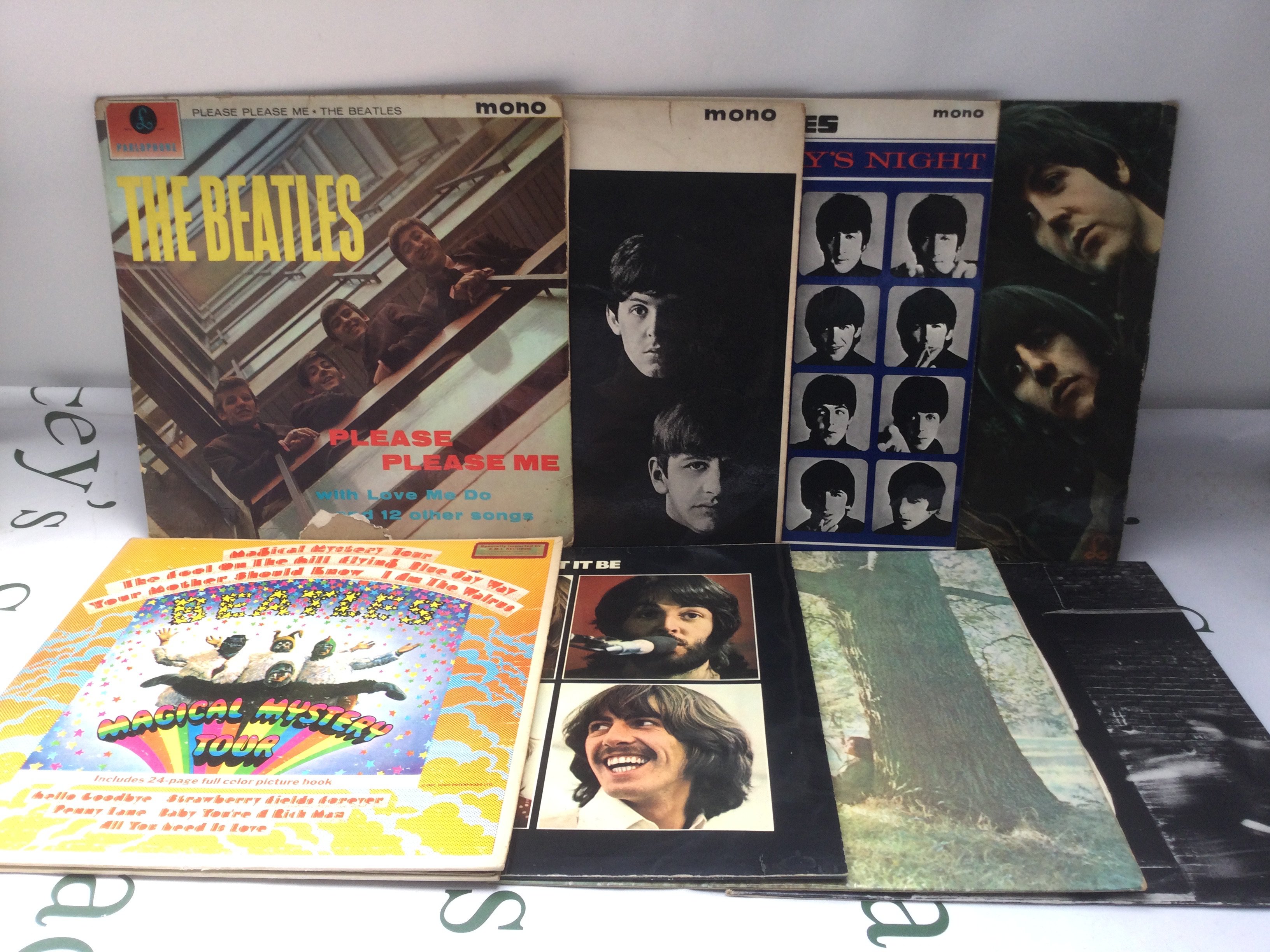 A collection of early pressings of Beatles LPs, EPs and 7" singles including Please Please Me (not black and gold labels), a US Capitol issued Magical Mystery Tour, Let It Be and others.