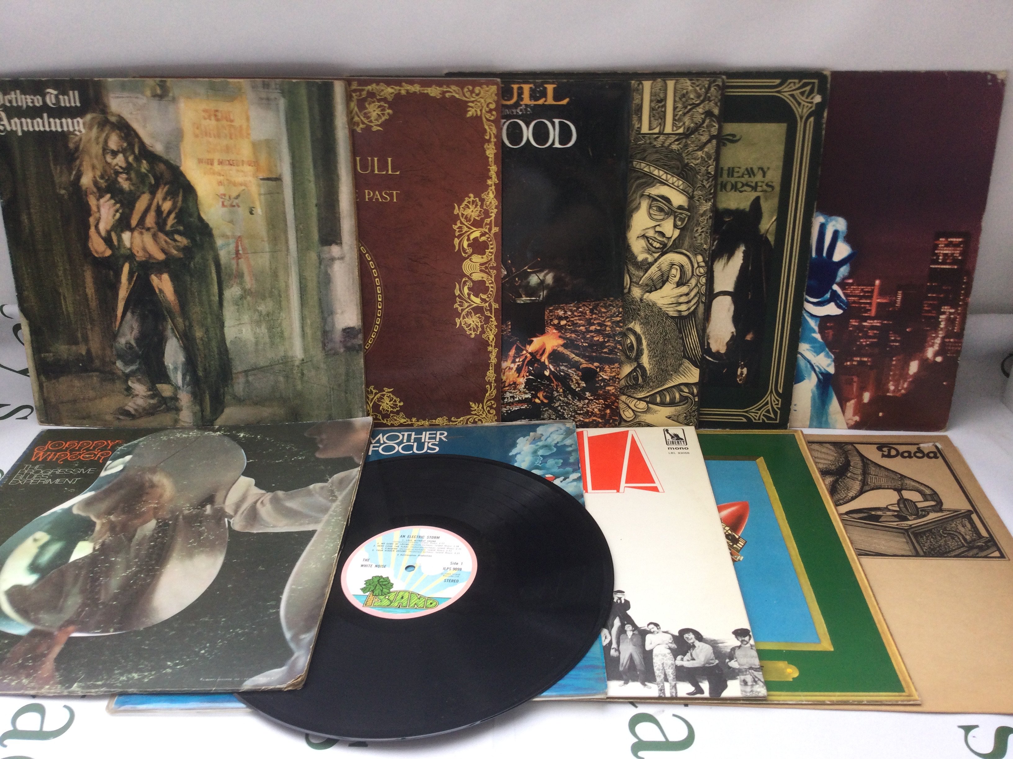 Two bags containing 24 prog, psych and folk rock LPs by various artists including Jethro Tull, Dada, Johnny Winter and others.