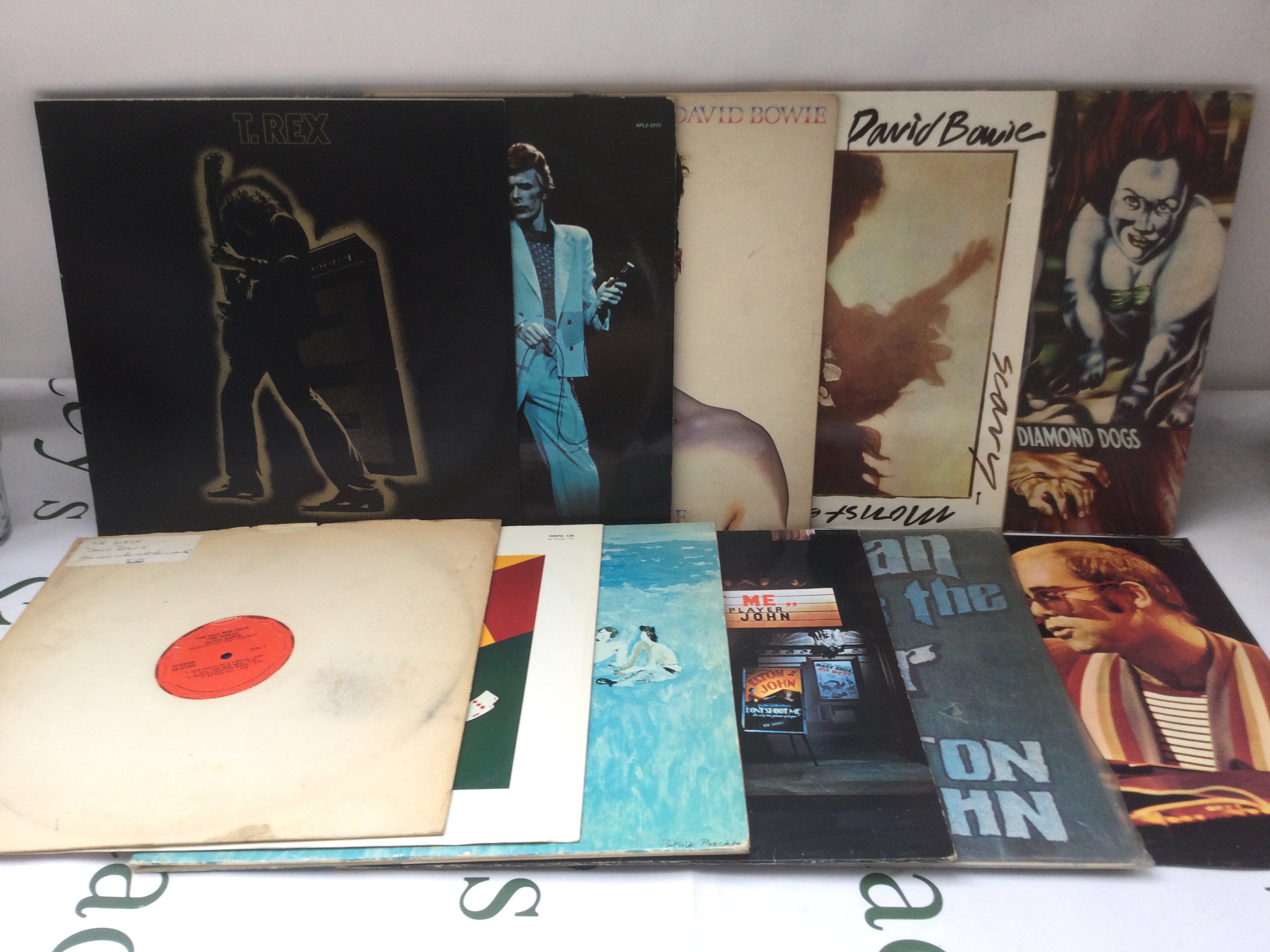 Eleven LPs by T Rex, David Bowie and Elton John.
