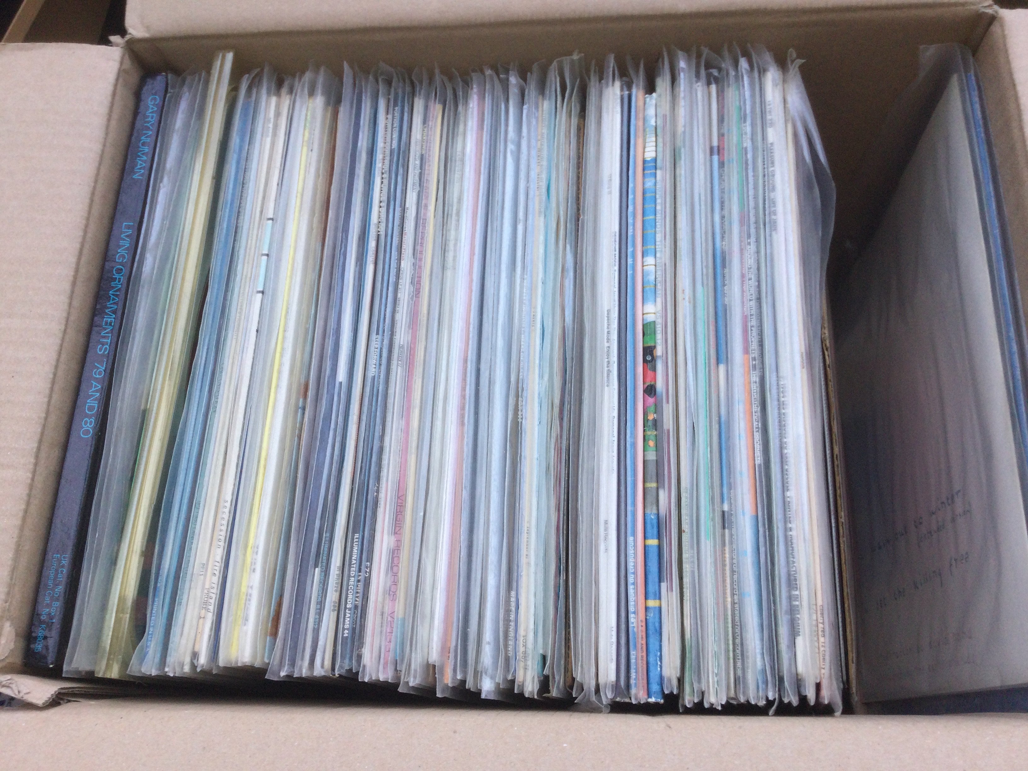 A box of electro and synth pop LPs and 12" singles by various artists including OMD, Depeche Mode, Gary Numan and many more.