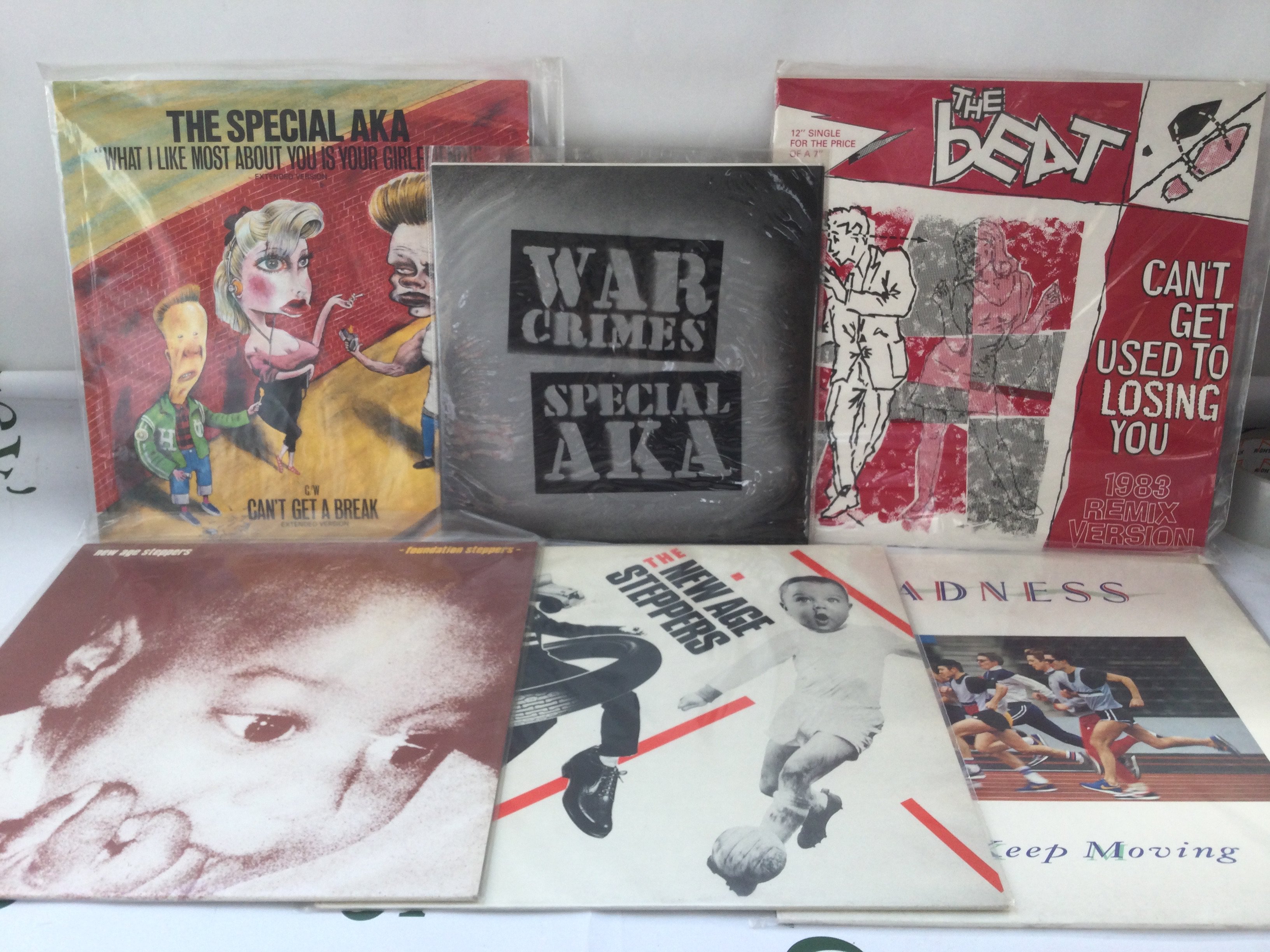 Twelve ska LPs and 12" singles by various artists including Madness, The Beat and others.