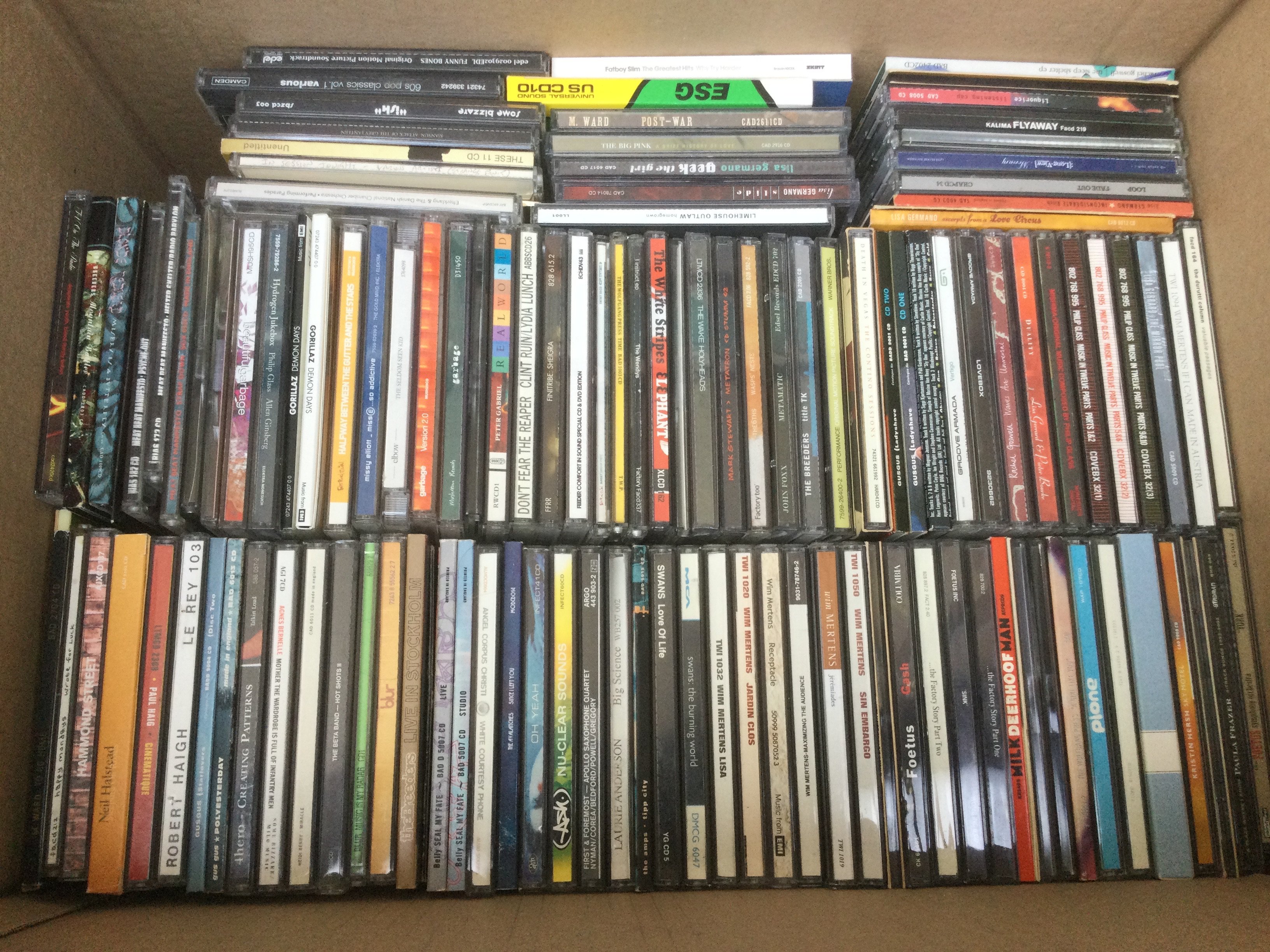 Two boxes of CDs by various artists including Nirvana, The Fall, Grandaddy and many more.