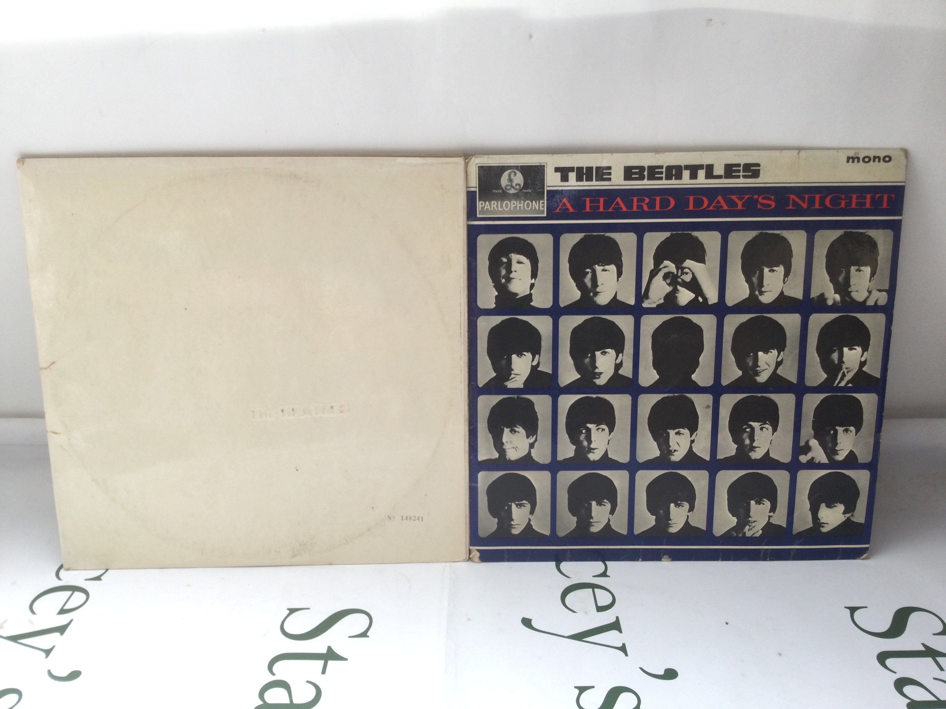 Two Beatles LPs comprising a numbered side loading 'White Album' (no portraits) and an early UK mono pressing of A Hard Day's Night.