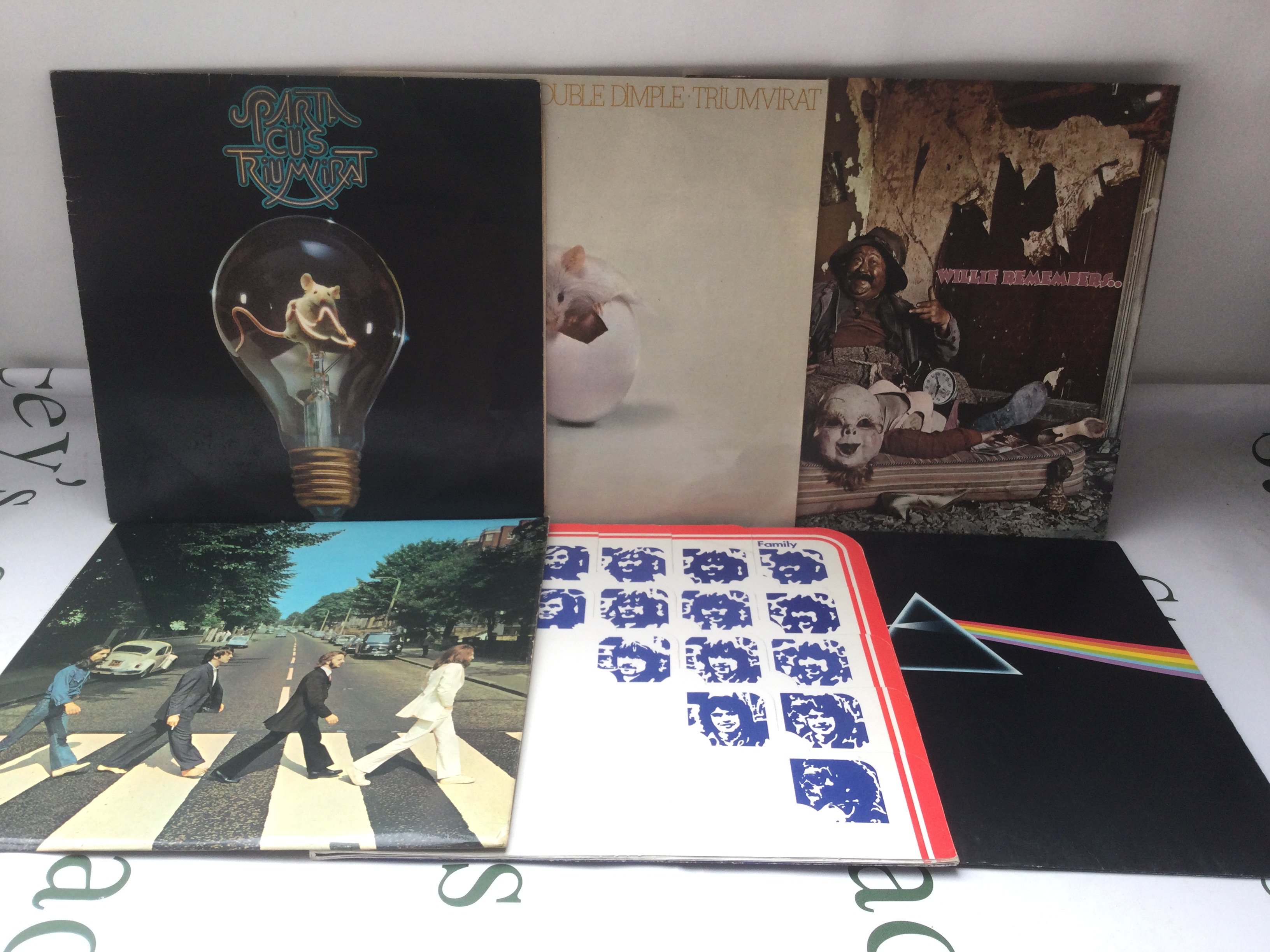 Twelve rock and prog rock LPs by various artists including The Beatles, Pink Floyd, Triumvirat and others.