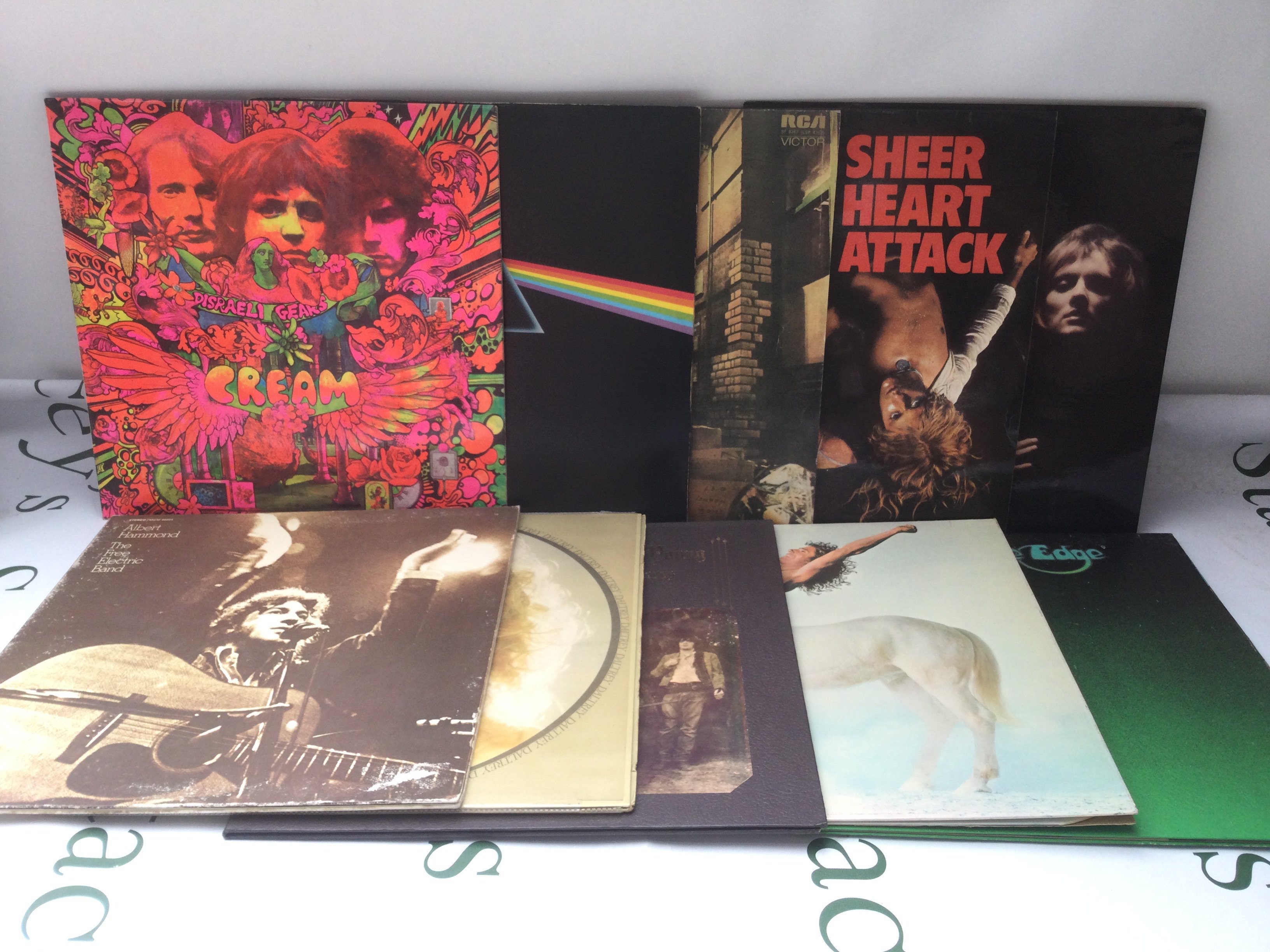 Two bags containing 20 LPs by various artists including David Bowie, Cream, Pink Floyd and others.