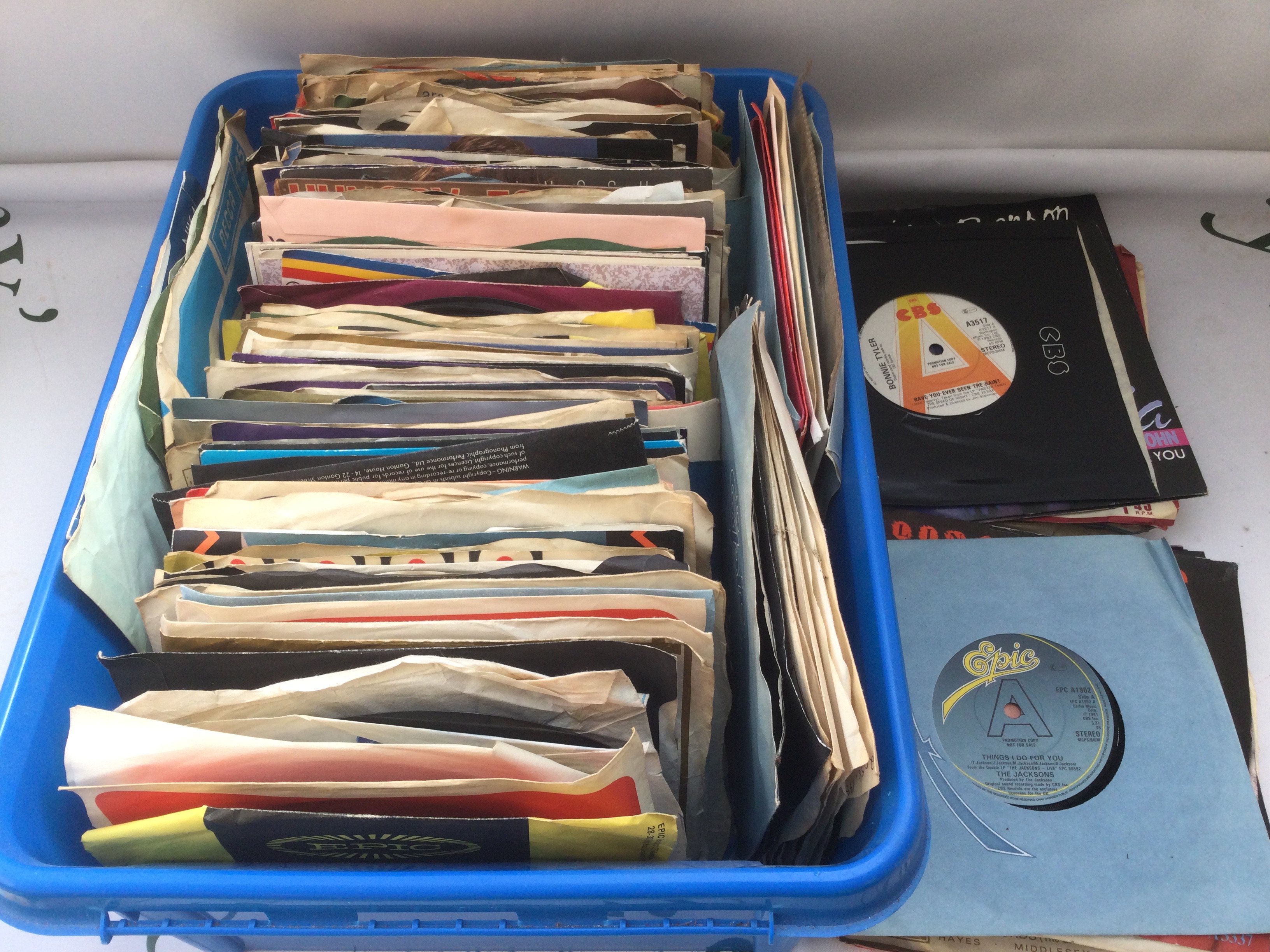 Two boxes of 7" singles including some promos by various artists from the 1960s onwards.