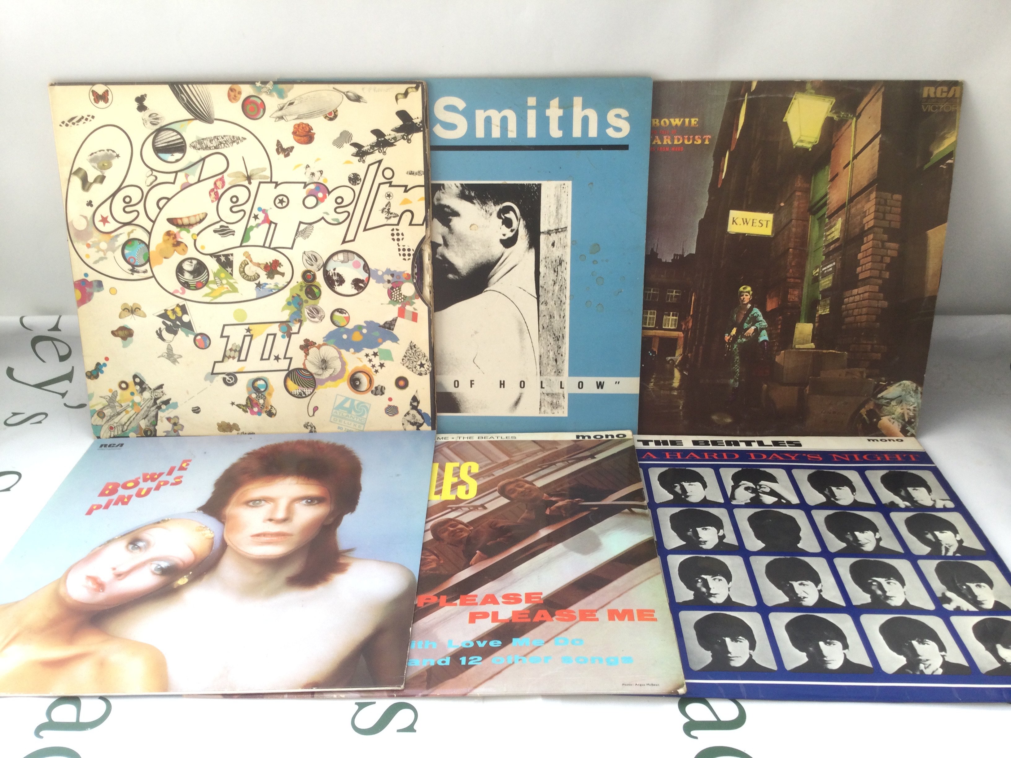 Twelve LPs by various artists including Led Zeppelin, The Beatles, David Bowie and others. Includes Led Zeppelin III on red/plum Atlantic labels, early UK Please Please Me (not black and gold labels) and others.