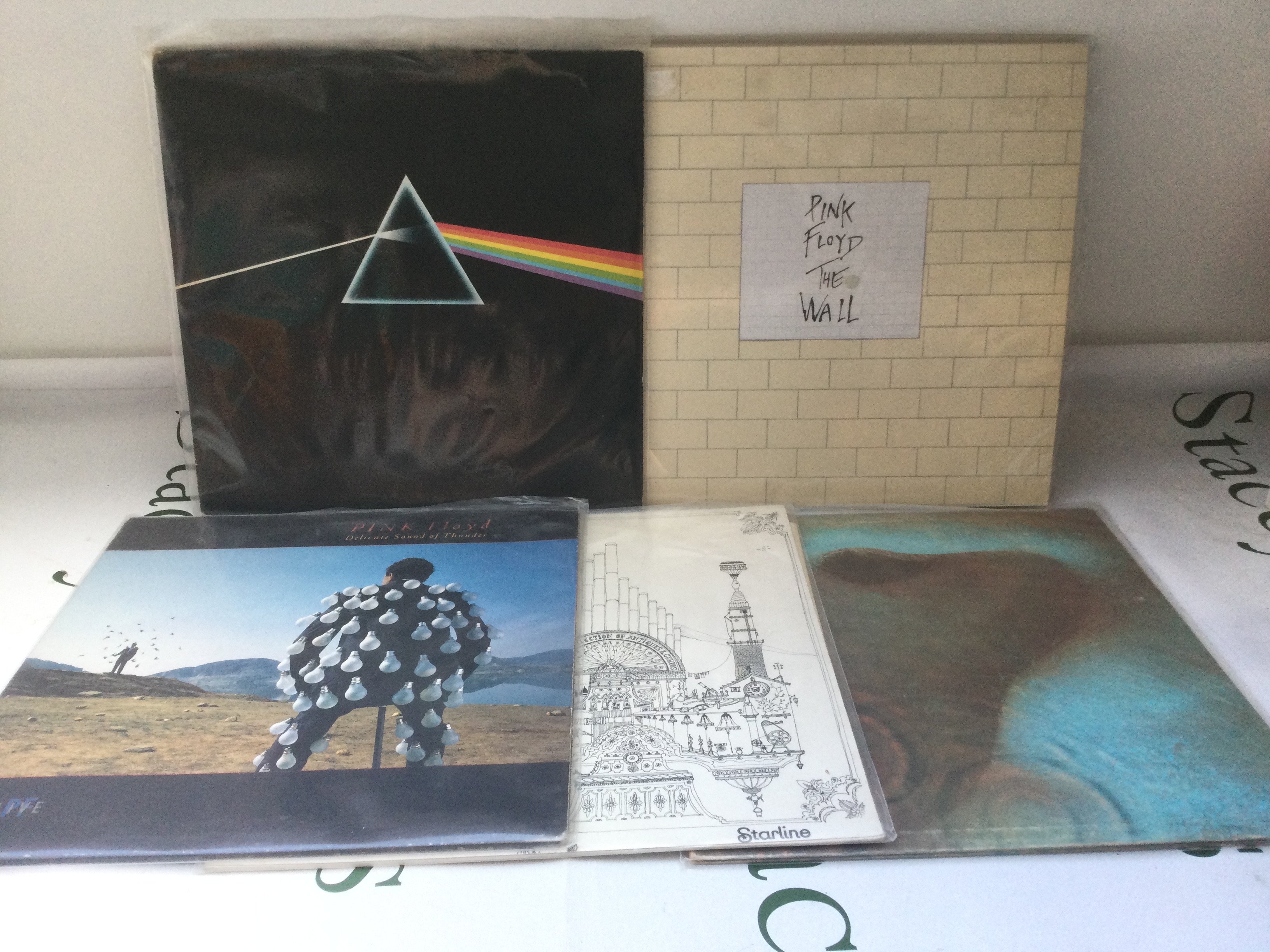 Five Pink Floyd LPs comprising The Wall, Meddle, Dark Side Of The Moon and others.