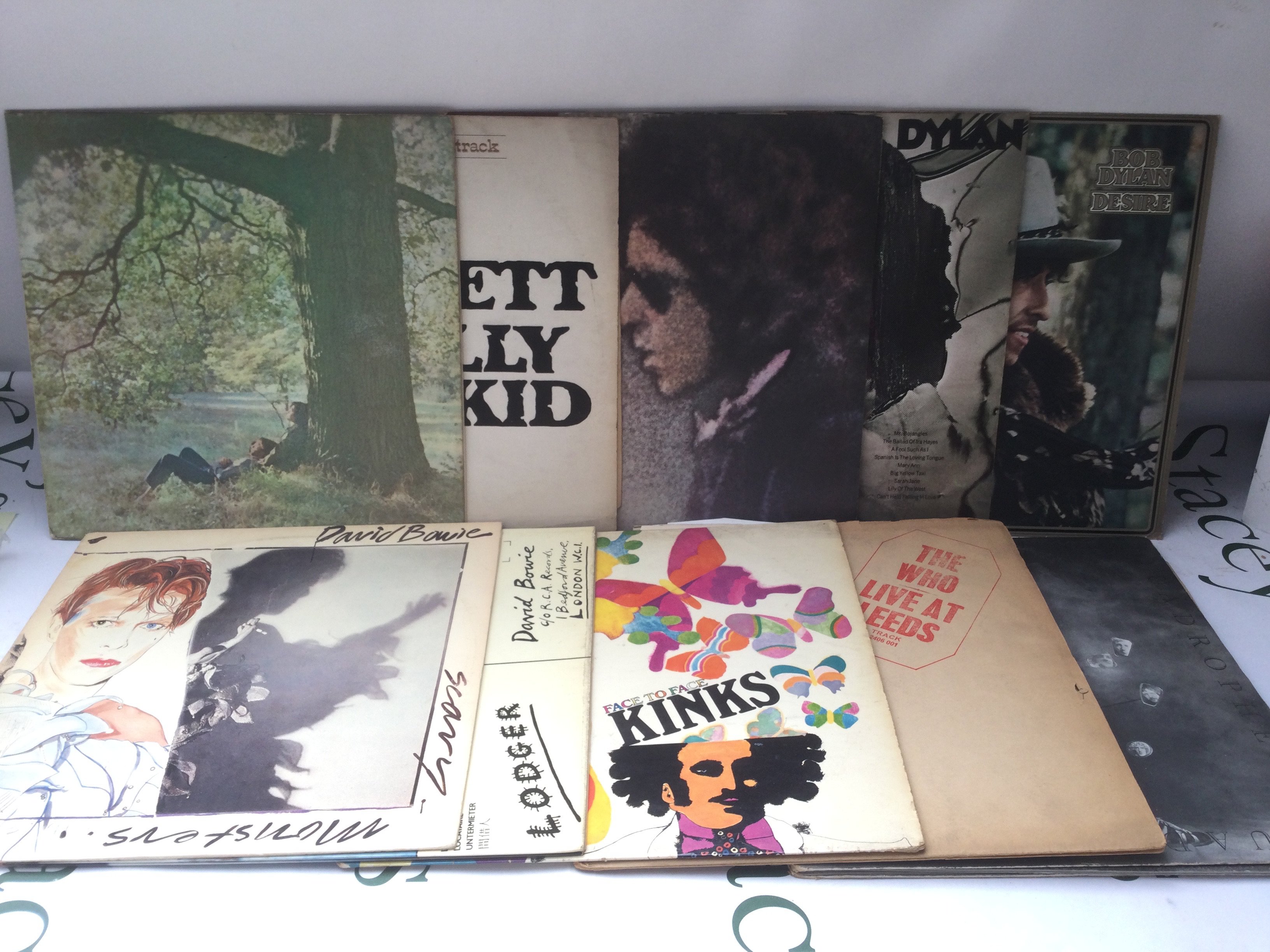 Ten rock LPs by various artists including John Lennon, David Bowie and others.