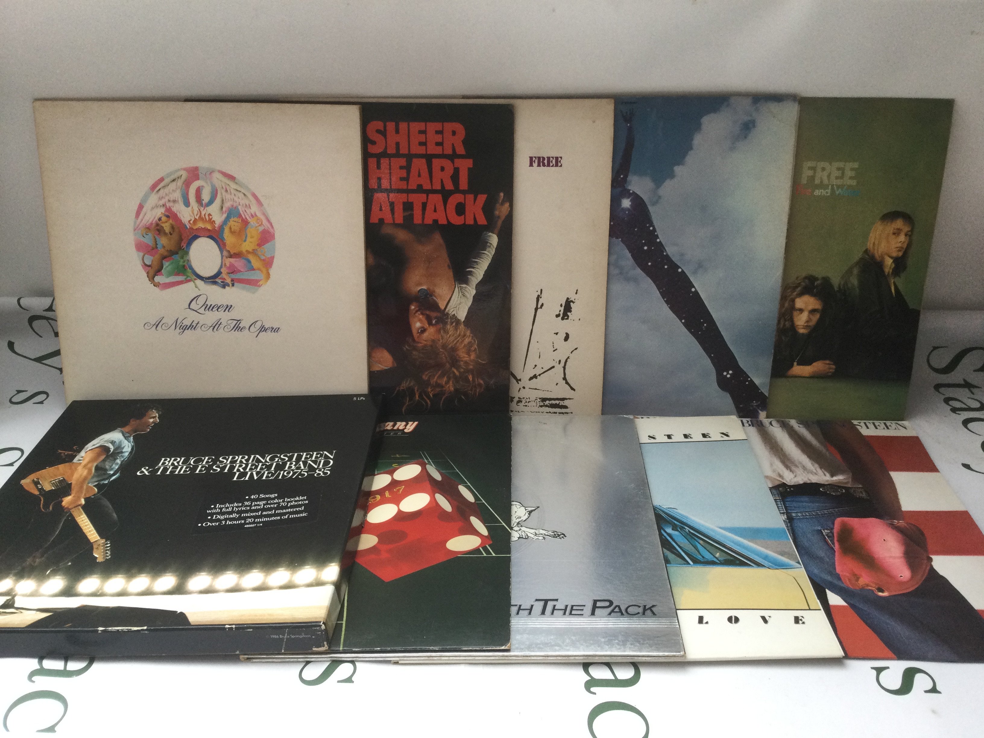 Ten rock LPs by various artists comprising Queen, Free, Bruce Springsteen and Bad Company.