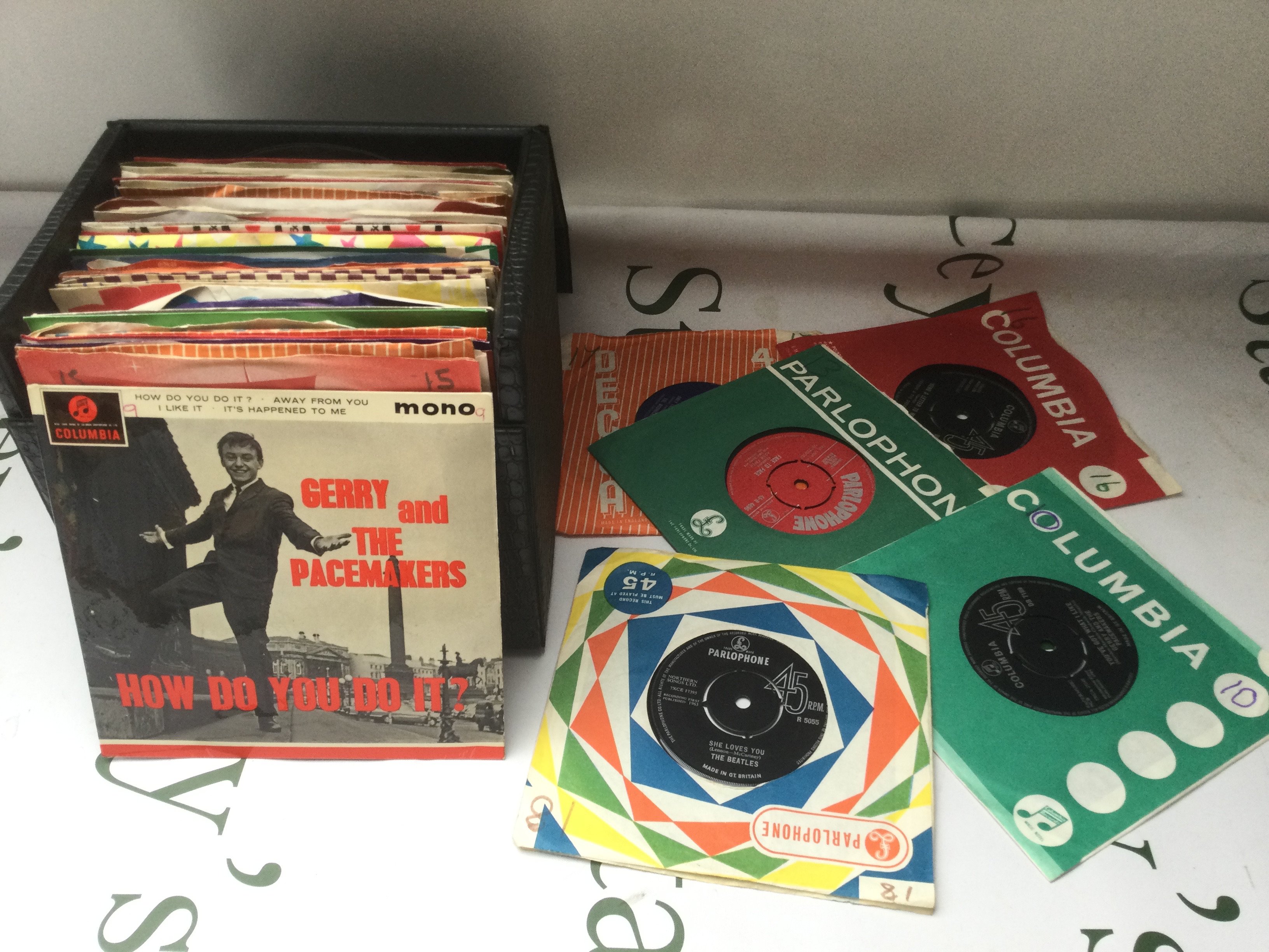 A bag and a record case of LPs, EPs and 7" singles by various artists including Pink Floyd, Patti Smith, Queen and others.