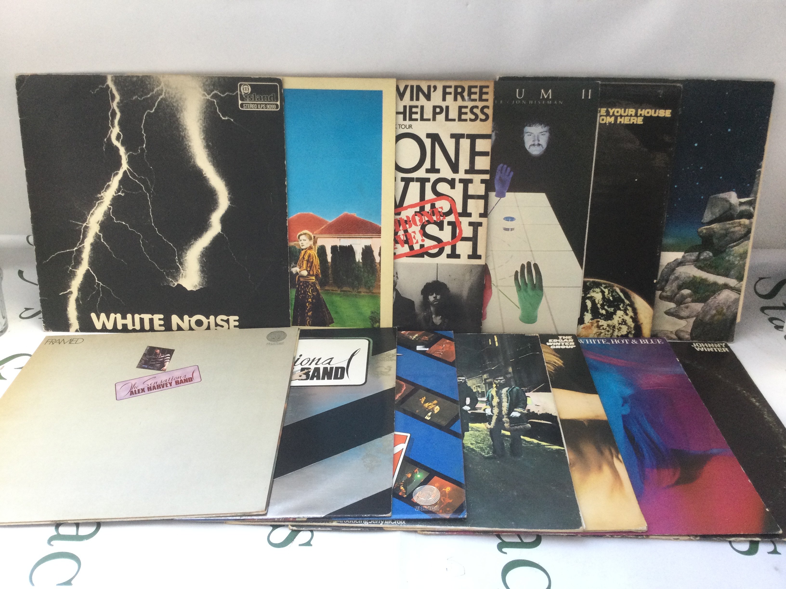 Thirteen prog rock LPs by various artists including Wishbone Ash, The Edgar Winter Group and others.