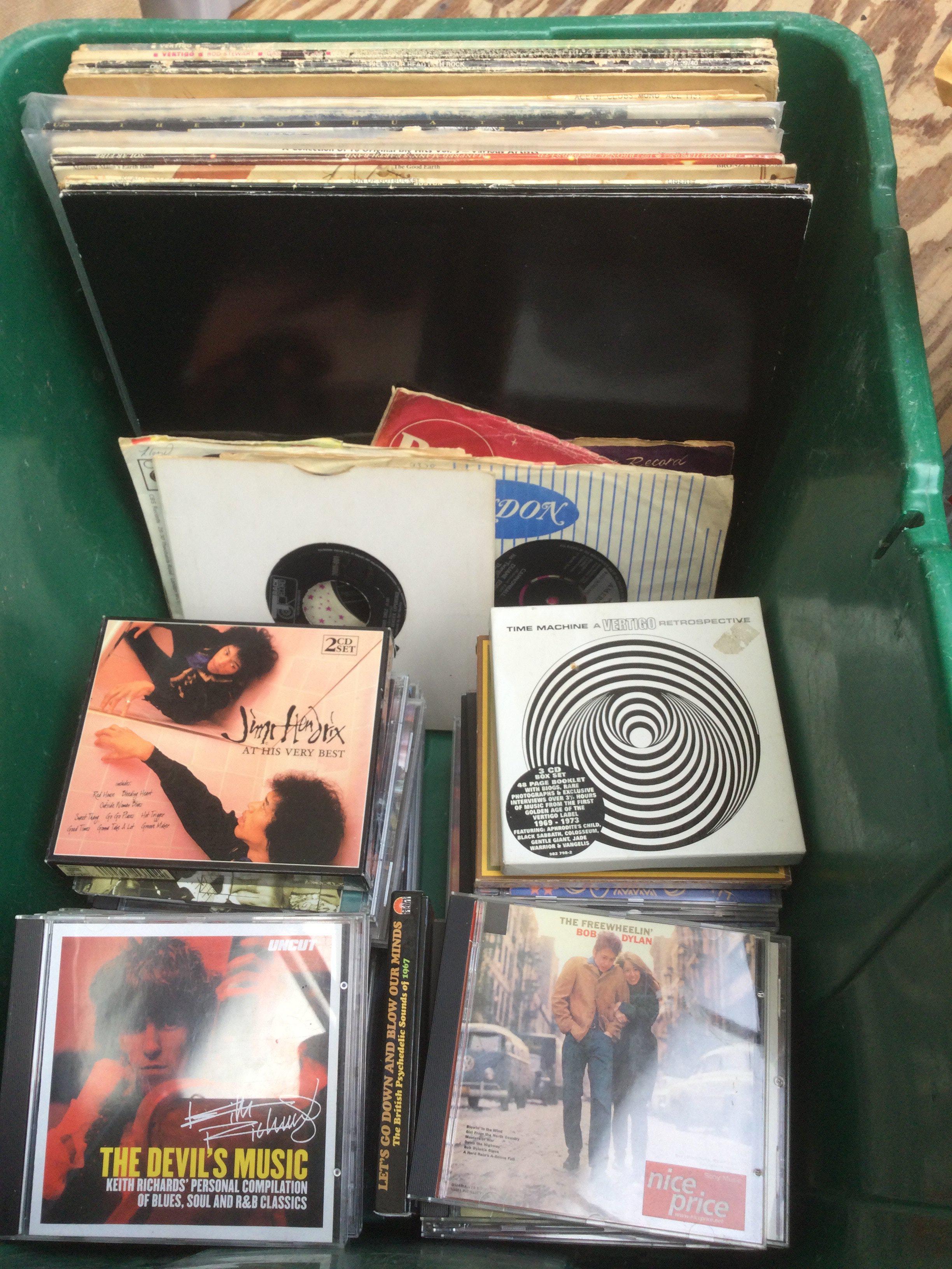 A crate of LPs, 7" simgles and CDs by various artists including Bob Dylan, Jimi Hendrix, Pink Floyd and many more.