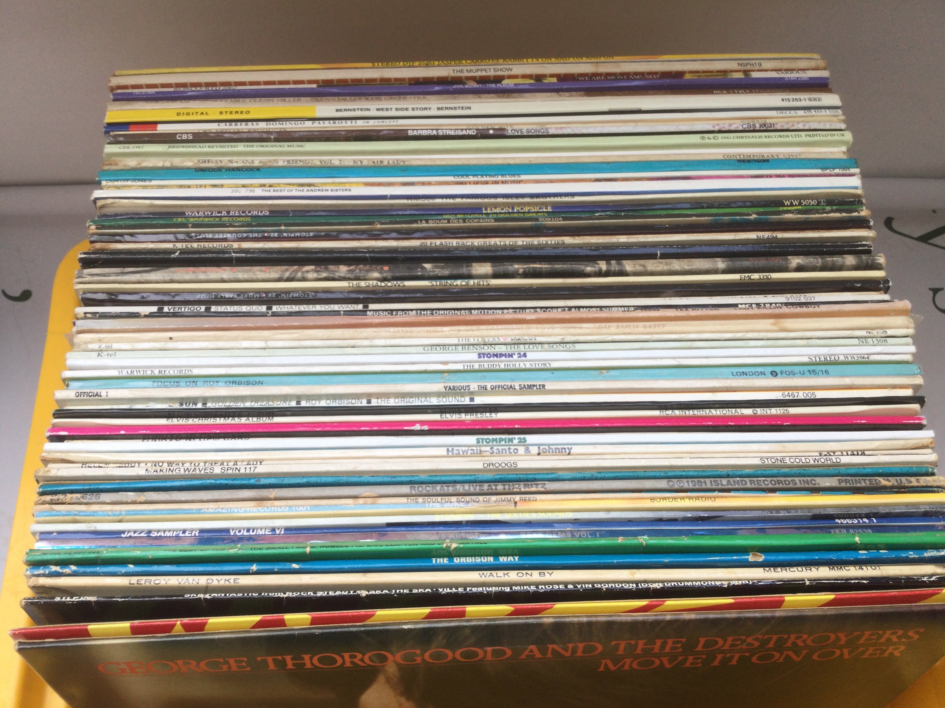 A collection of over 60LPs by various artists including some reggae, rock n roll and pop artists.