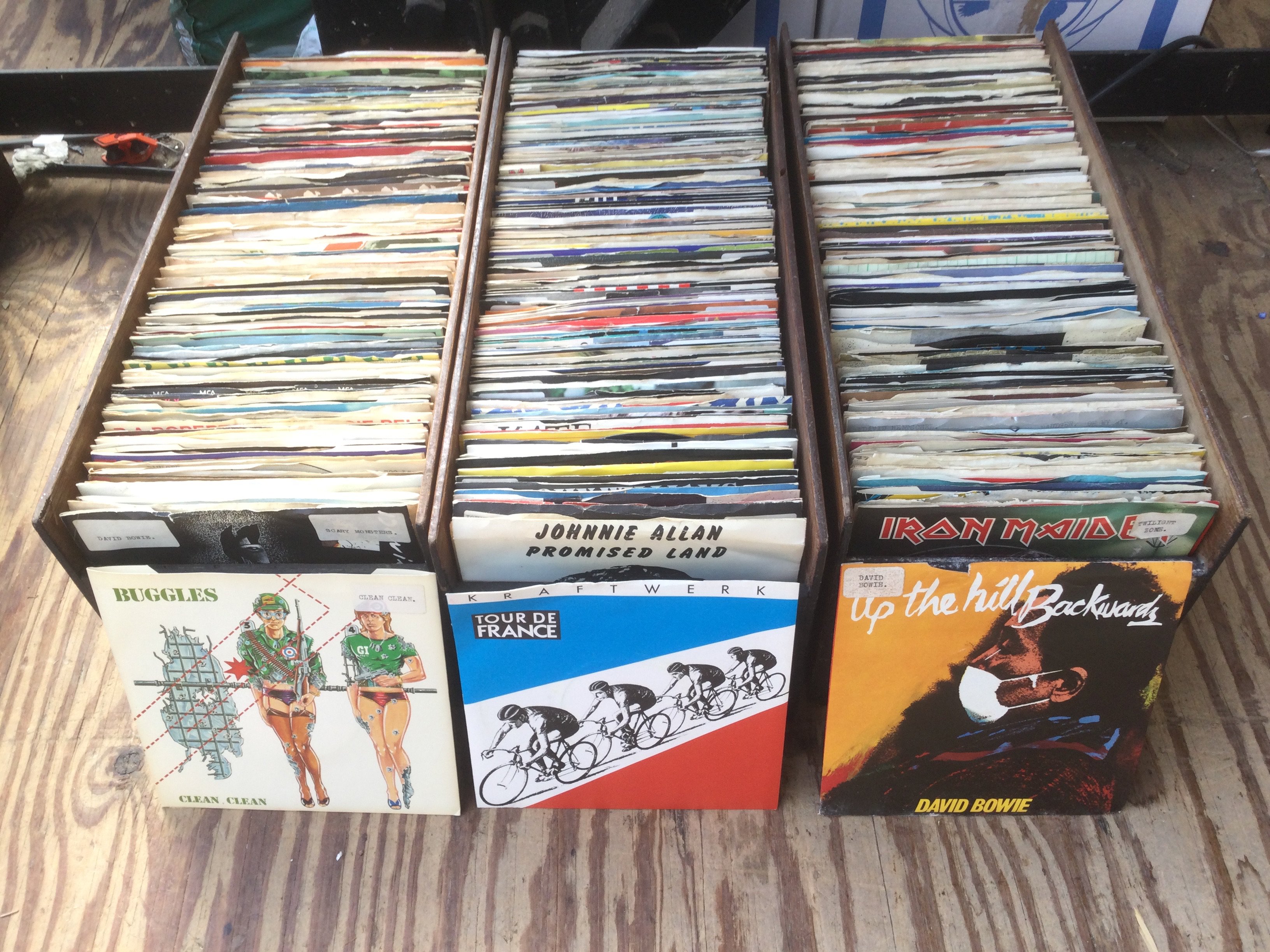 Eight small boxes of 7" singles including some promos and picture discs. Various artists including The Smiths, Kraftwerk, Dead Kennedys and many more.