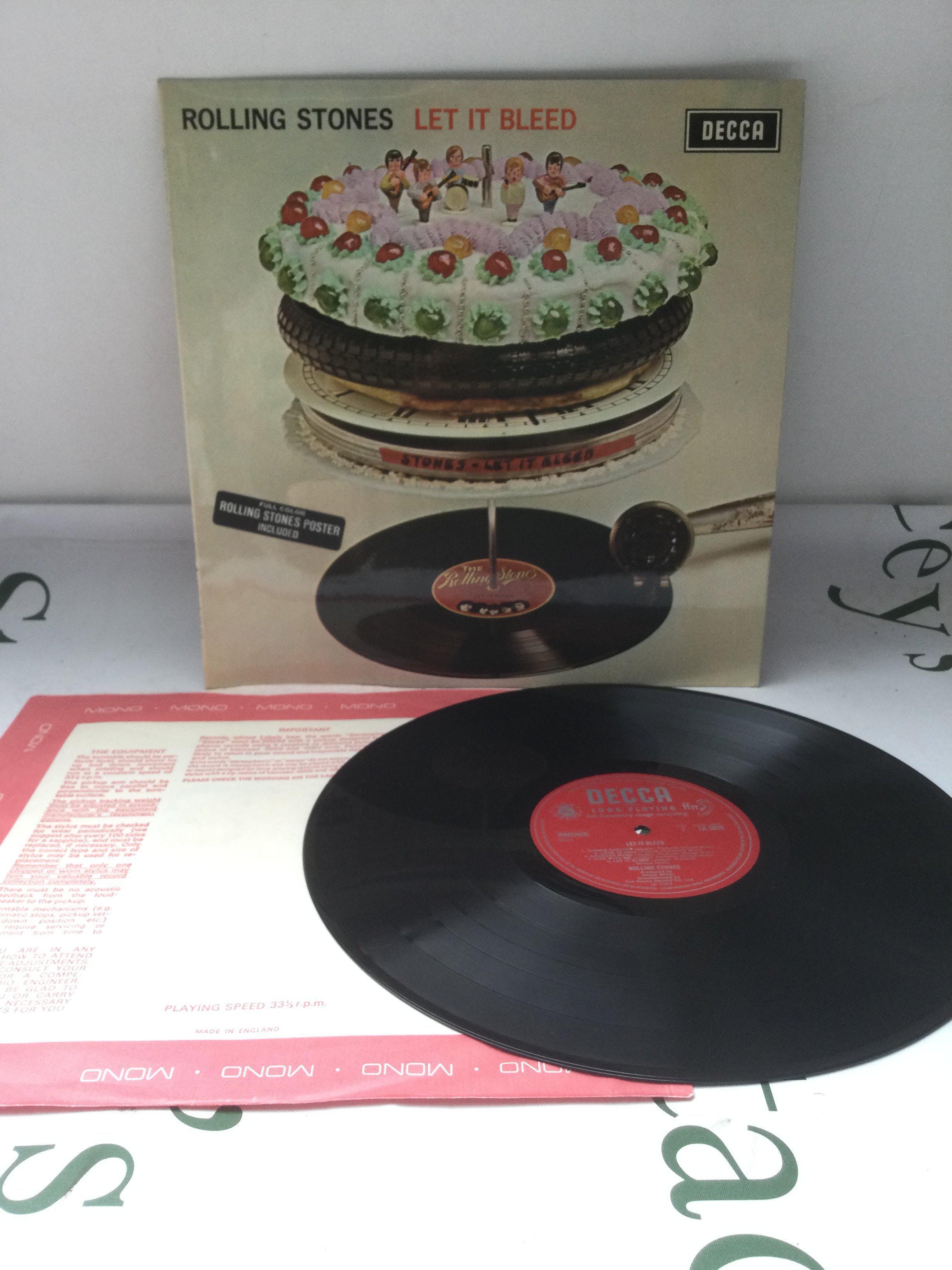 A first UK mono pressing of The Rolling Stones Let It Bleed LP complete with poster. EX/EX.