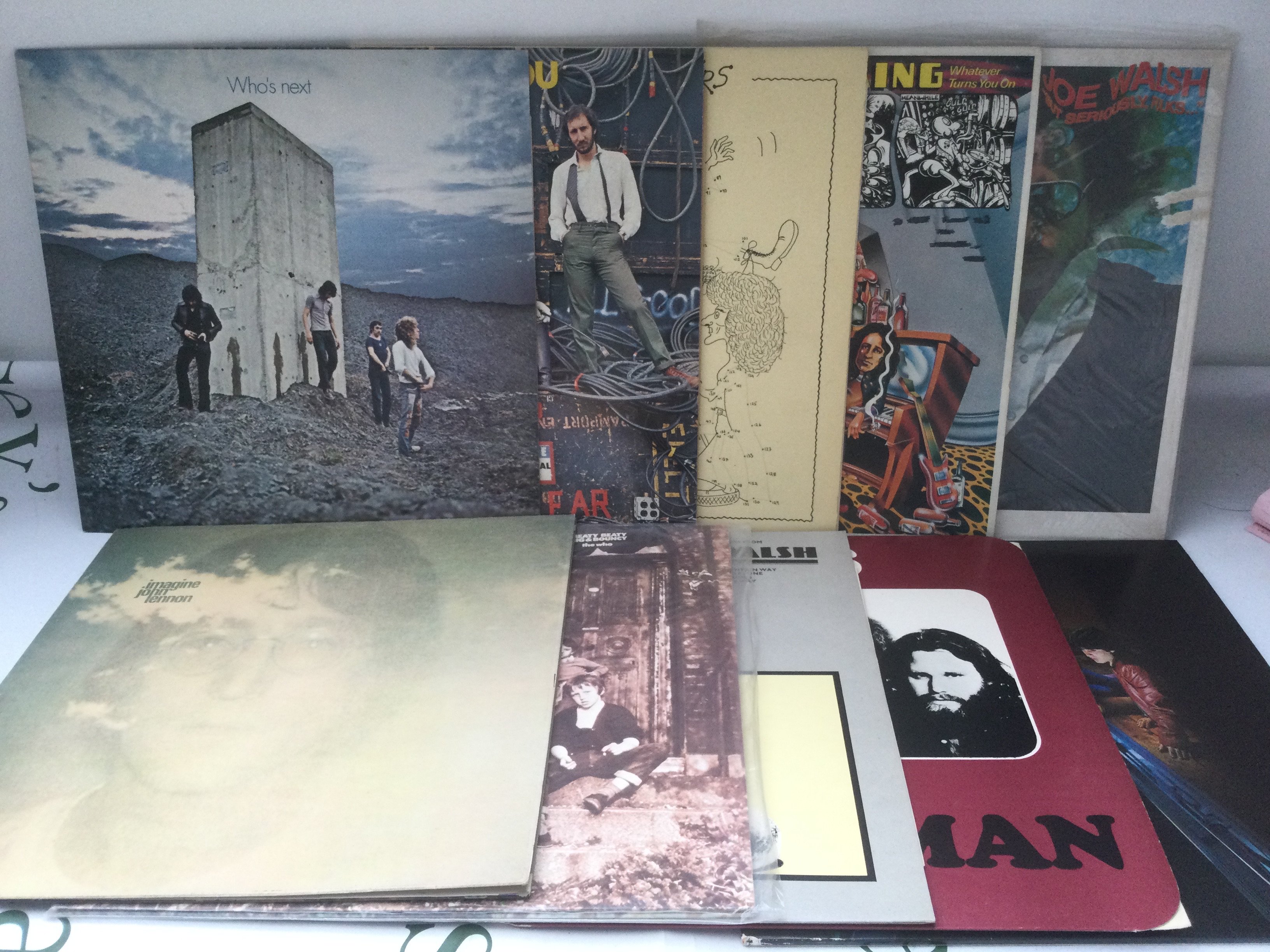 Ten rock LPs by various artists including The Who, The Doors and others.