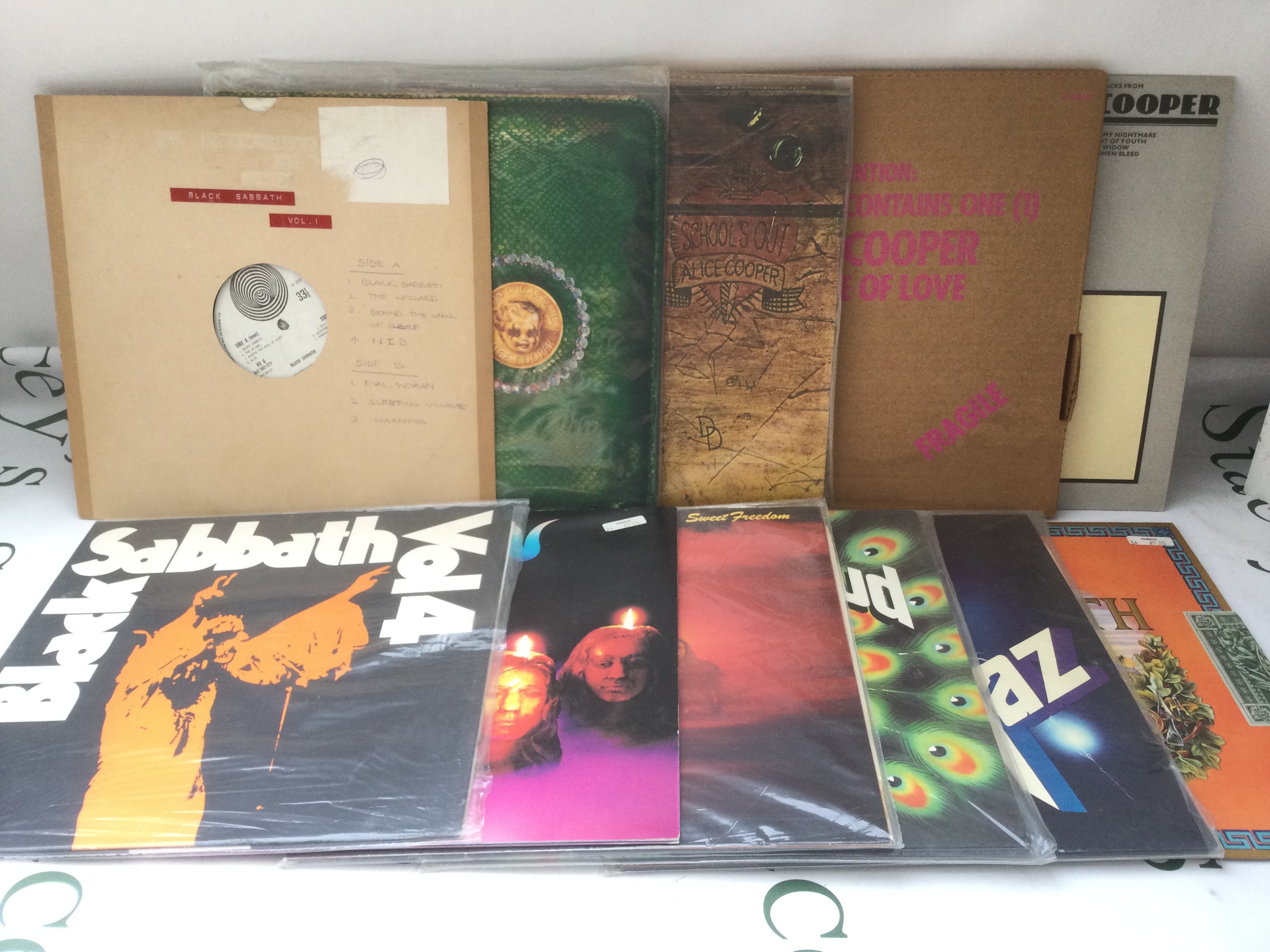 Eleven heavy rock LPs by various artists including Black Sabbath, Alice Cooper, Deep Purple and others.