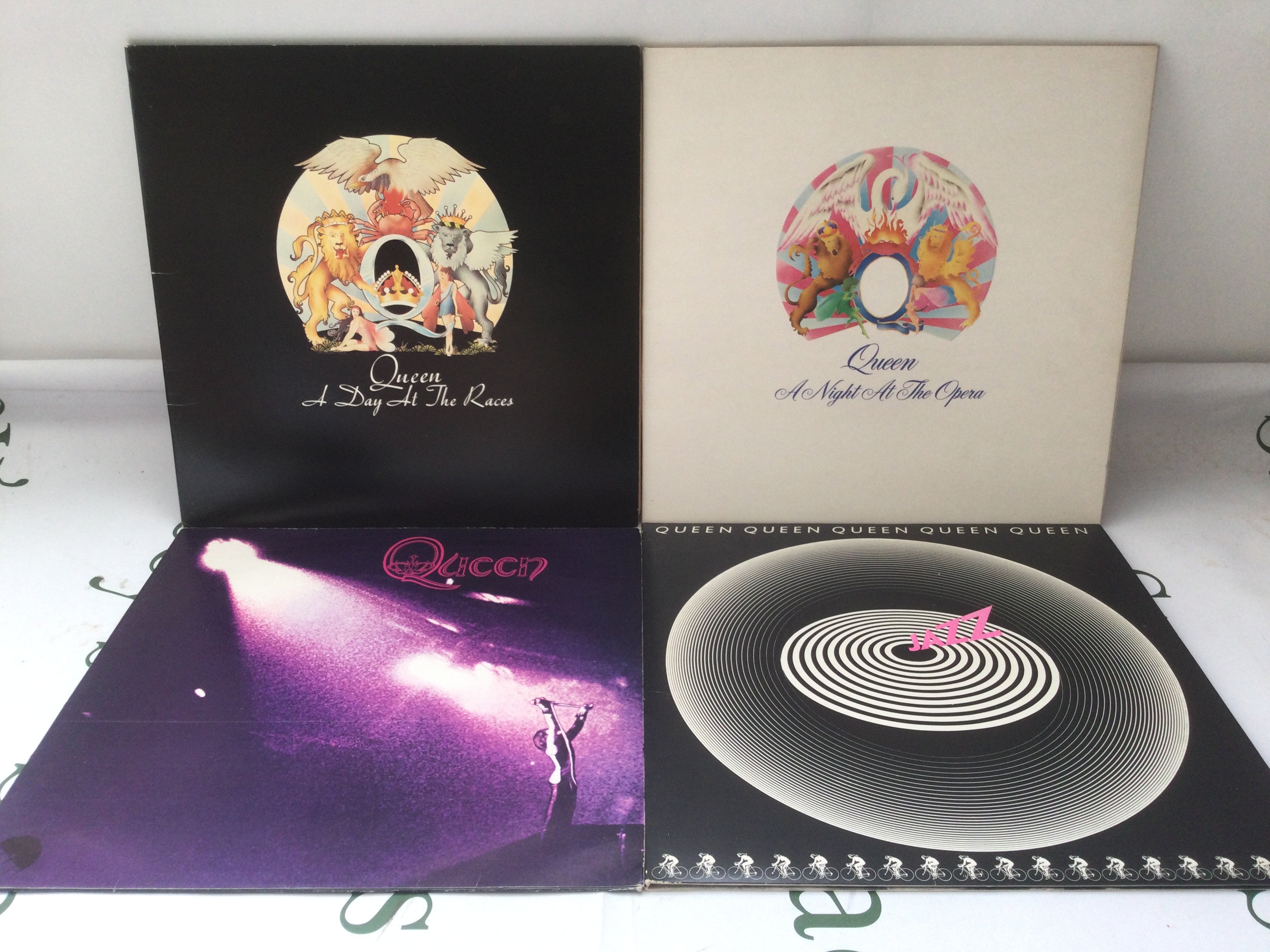 Four Queen LPs comprising A Day At The Races, Jazz, Queen and A Night At The Opera.