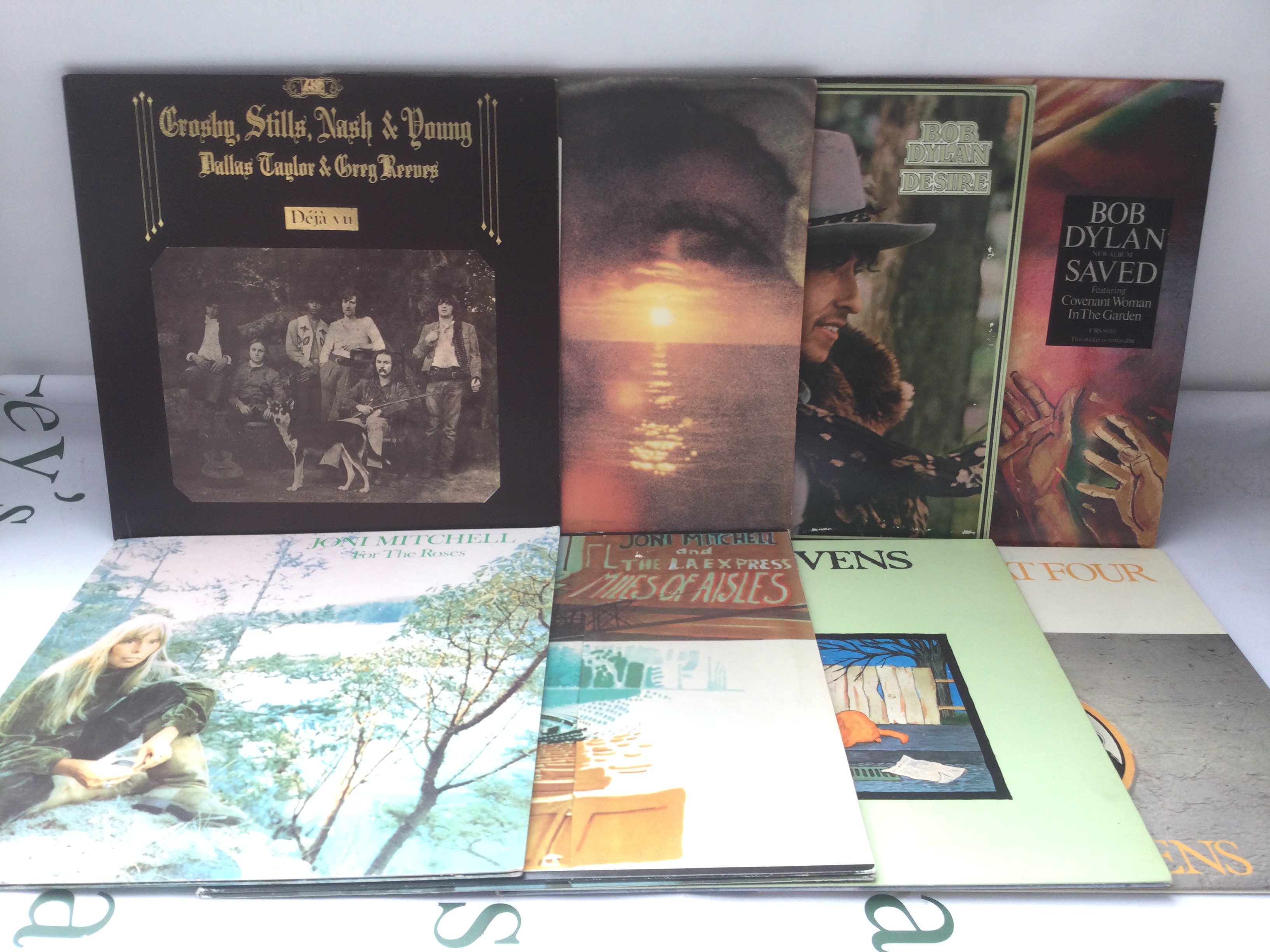 Two bags containing 17 folk rock LPs by various artists including Bob Dylan, CSNY, Neil Young and others.