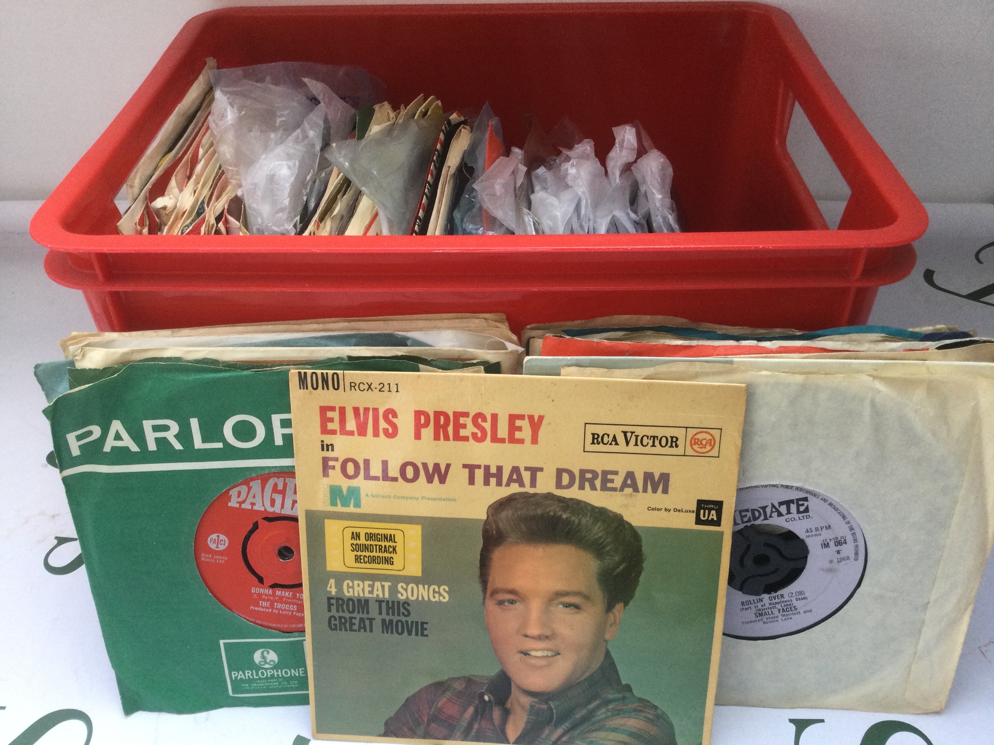 A collection of 7" singles and EPs by various artists including Elvis Presley, Billy Fury, Small Faces and others.