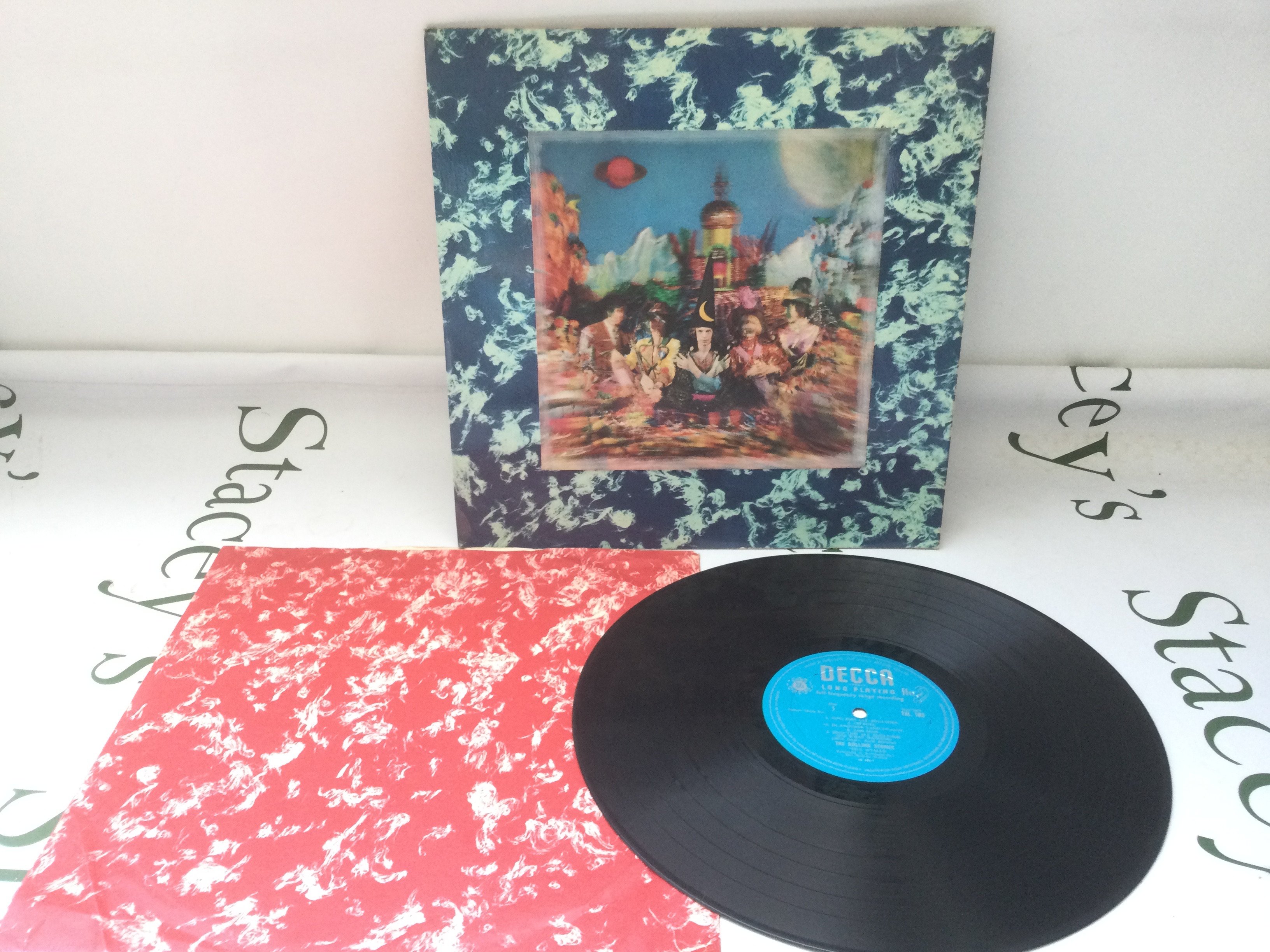 A first UK mono pressing of The Rolling Stones LP Their Satanic Majesties Request, TXL 103 with turquoise deep groove Decca label and 1P/ P1 matrix. Includes original red and white printed inner sleeve. Vinyl and sleeve both EX, inner sleeve VG+.