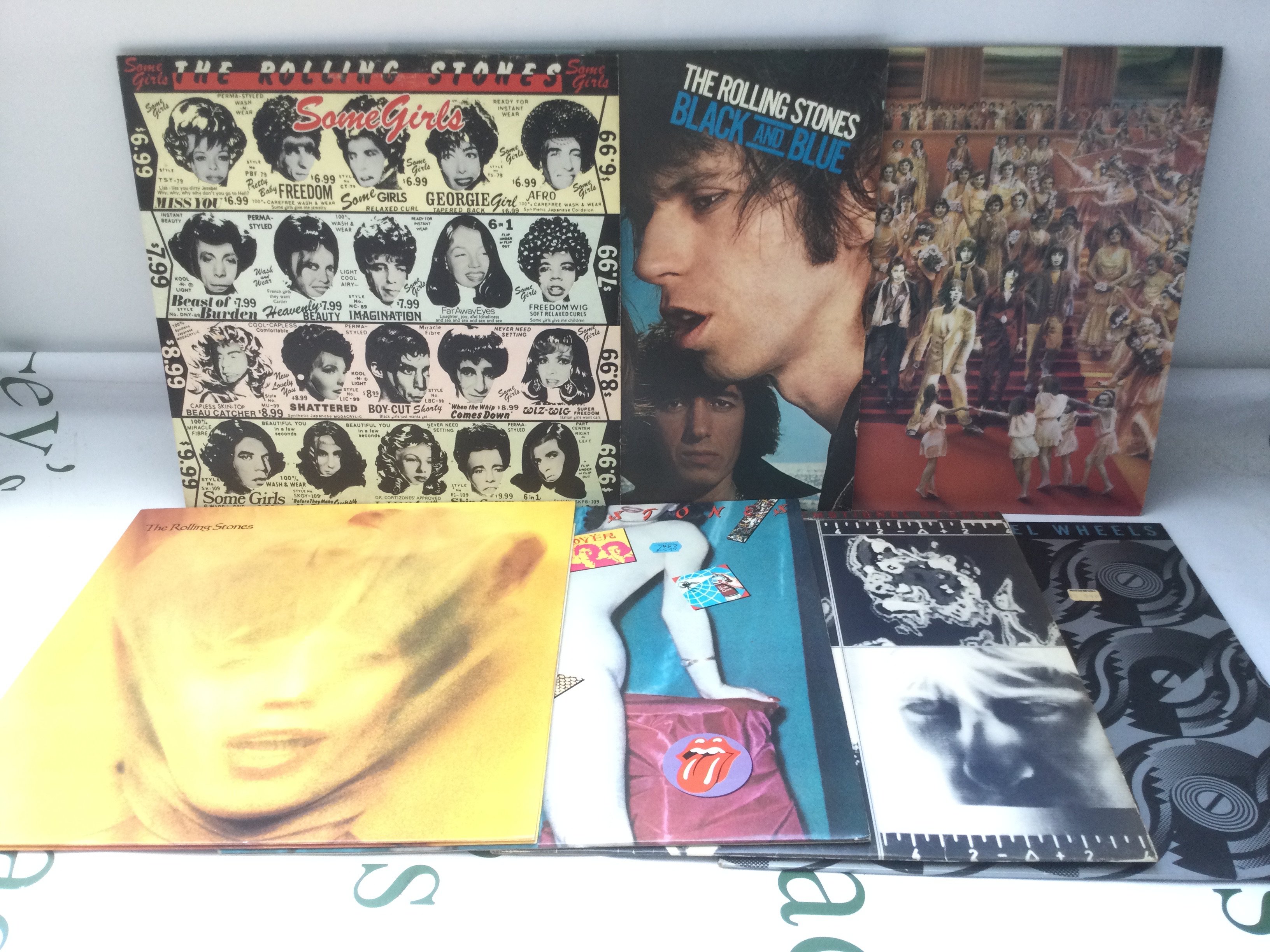 Fourteen Rolling Stones and related LPs comprising Goat's Head Soup, Steel Wheels, Some Girls and others.