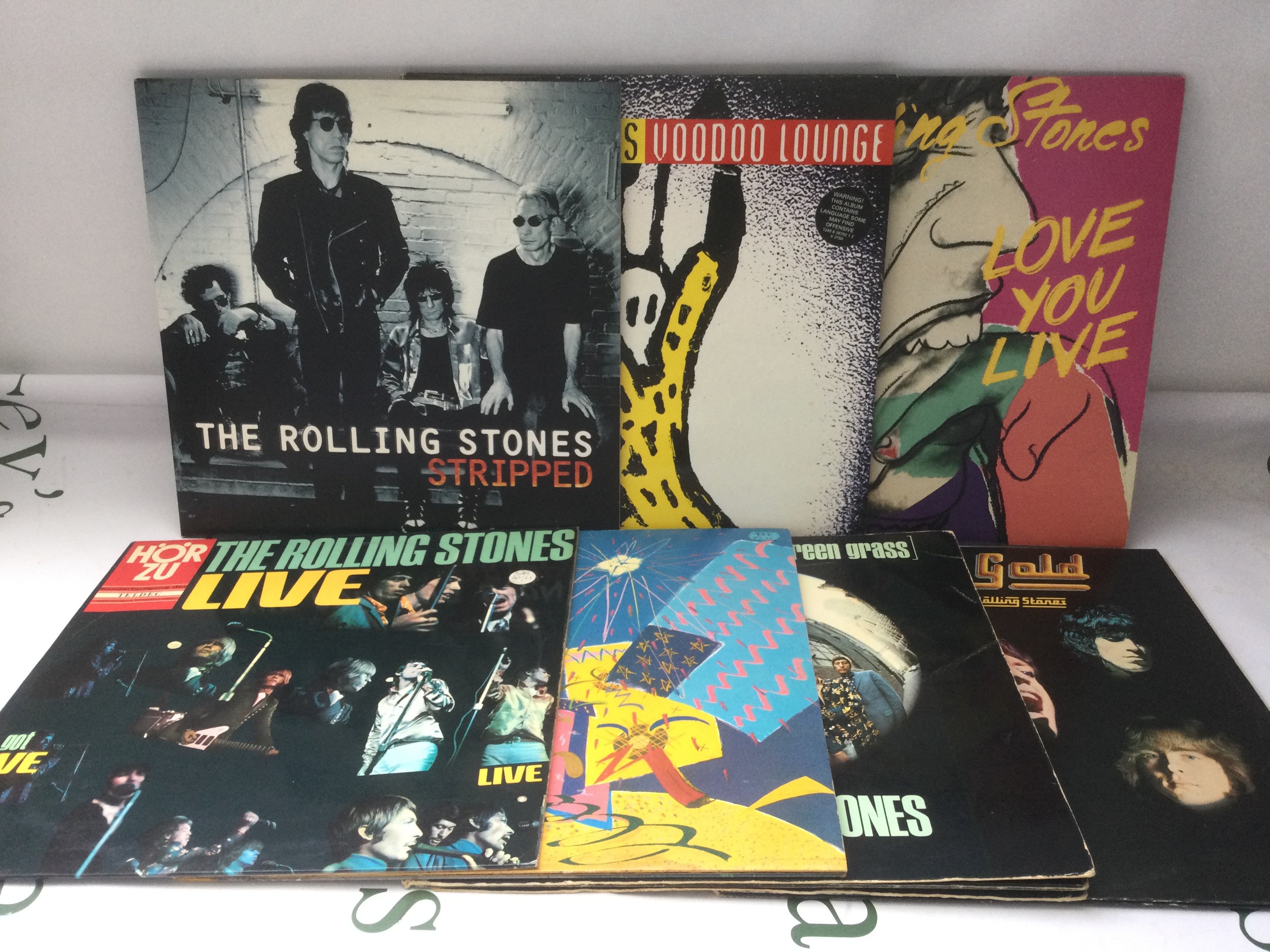 Fourten Rolling Stones LPs and 12" singles comprising Stripped, Voodoo Lounge, Love You Live and others.