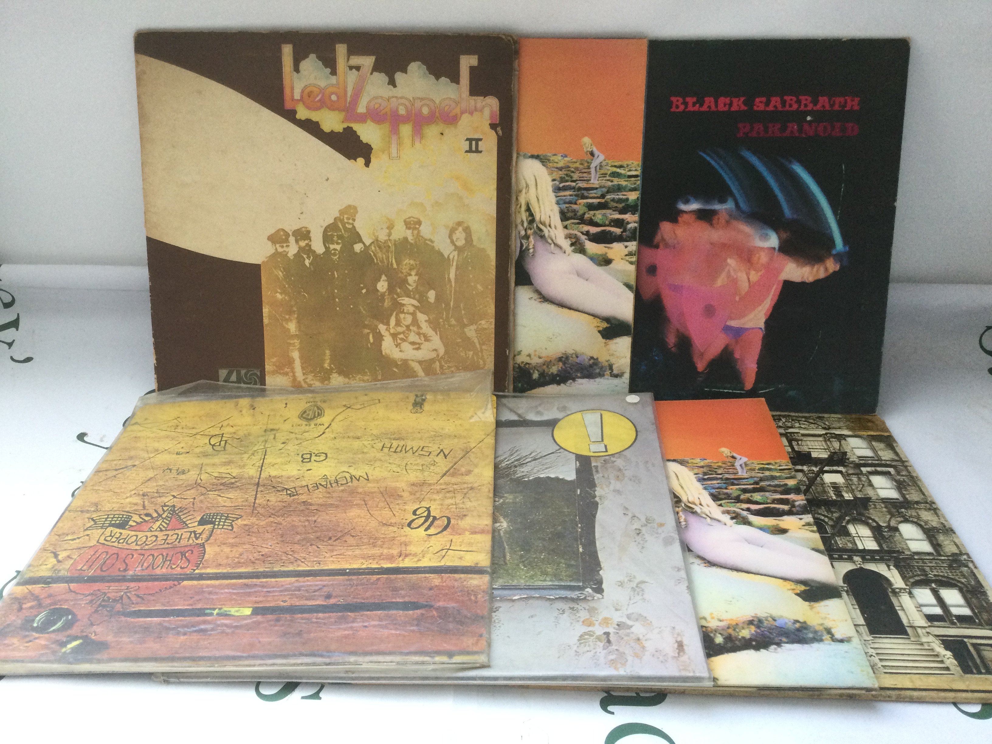 Seven rock LPs by Led Zeppelin, Black Sabbath and Alice Cooper including a red/plum Atlantic label Led Zep II, early UK Paranoid etc.