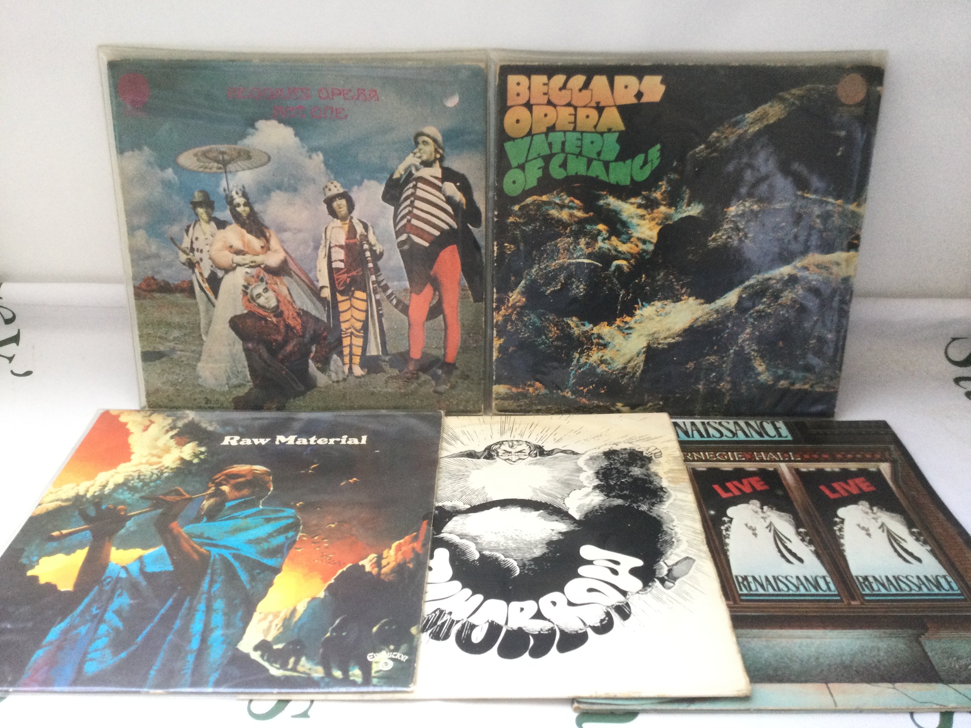 Five early UK pressings of prog rock LPs by various artists including Beggars Opera, Raw Material, Tomorrow and Renaissance.