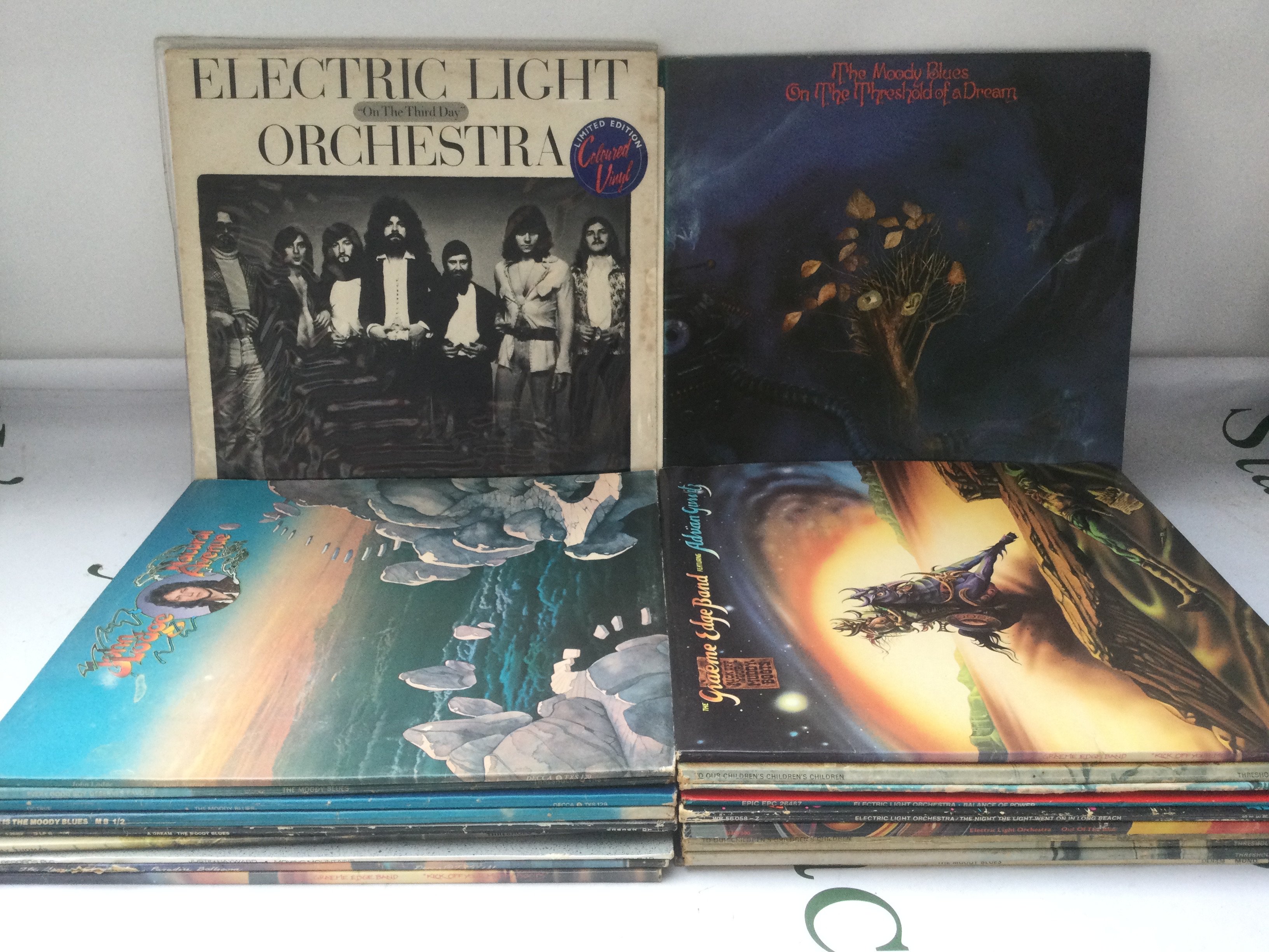 A collection of ELO, Moody Blues and related LPs.