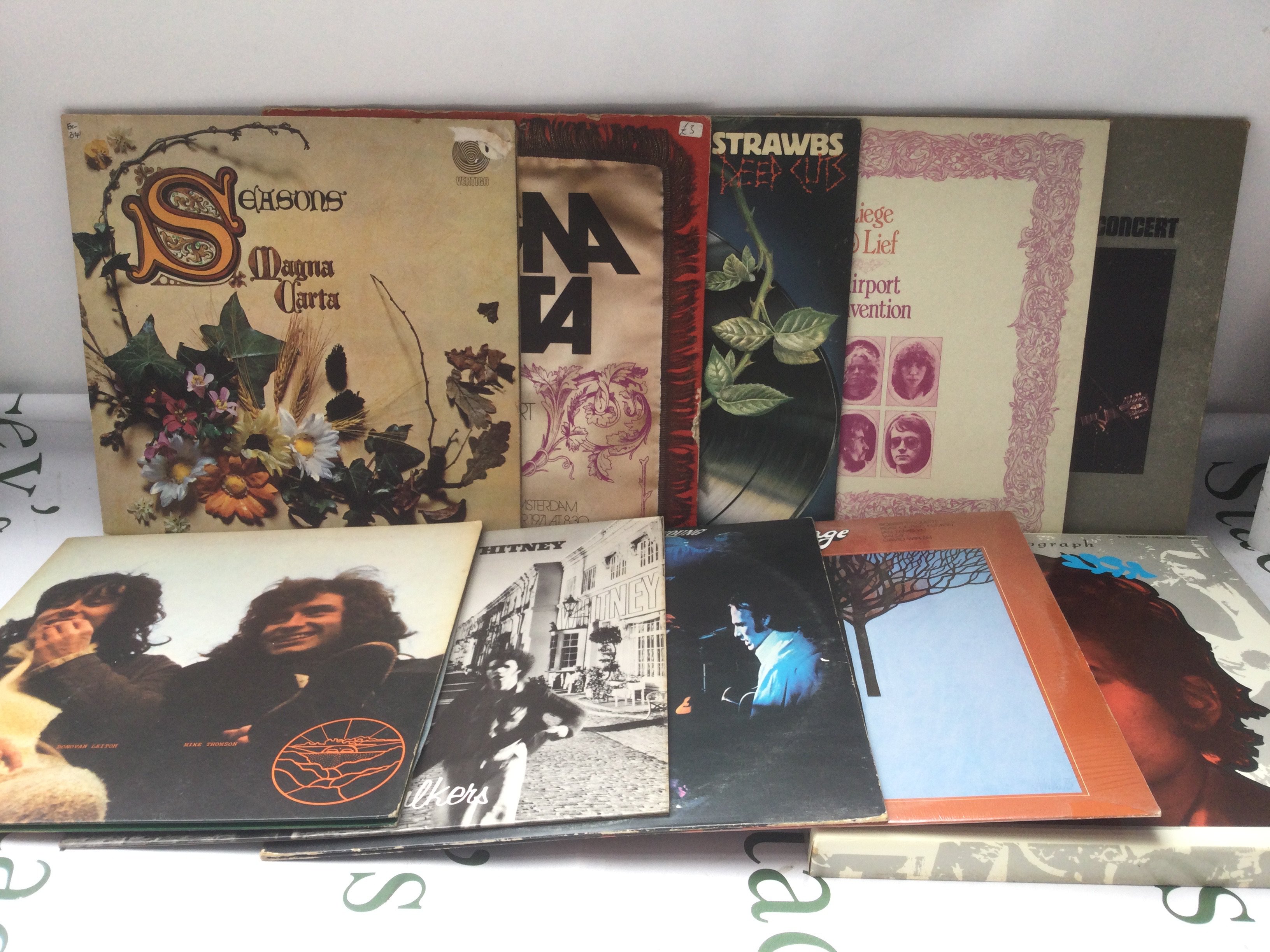 Two bags containing 20 folk LPs by various artists including Magna Carta, Fairport Convention, Bob Dylan and others. Please note Biograph is missing record 1.