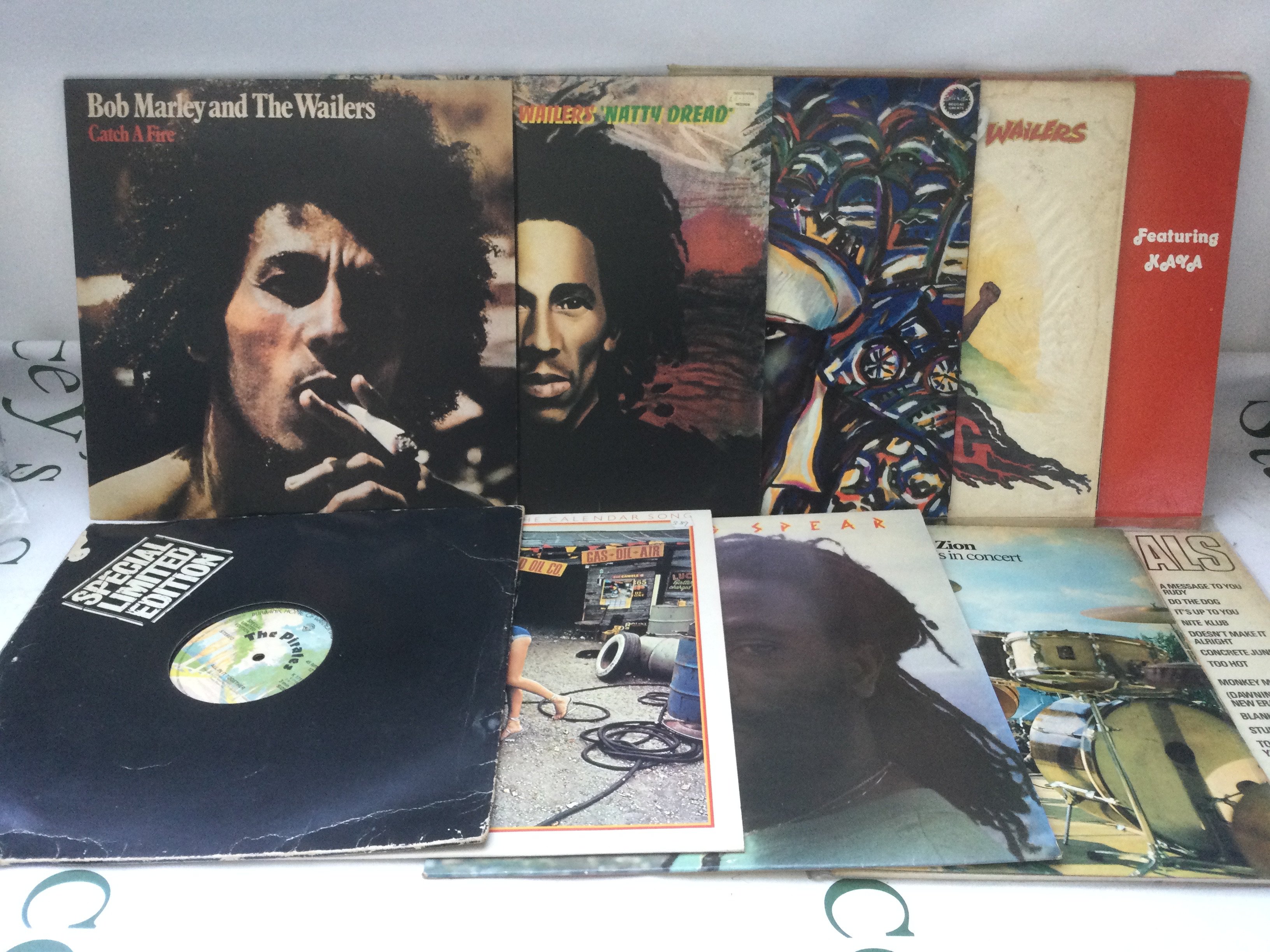 Ten reggae and ska LPs and 12" singles by various artists including Bob Marley, Burning Spear and others.