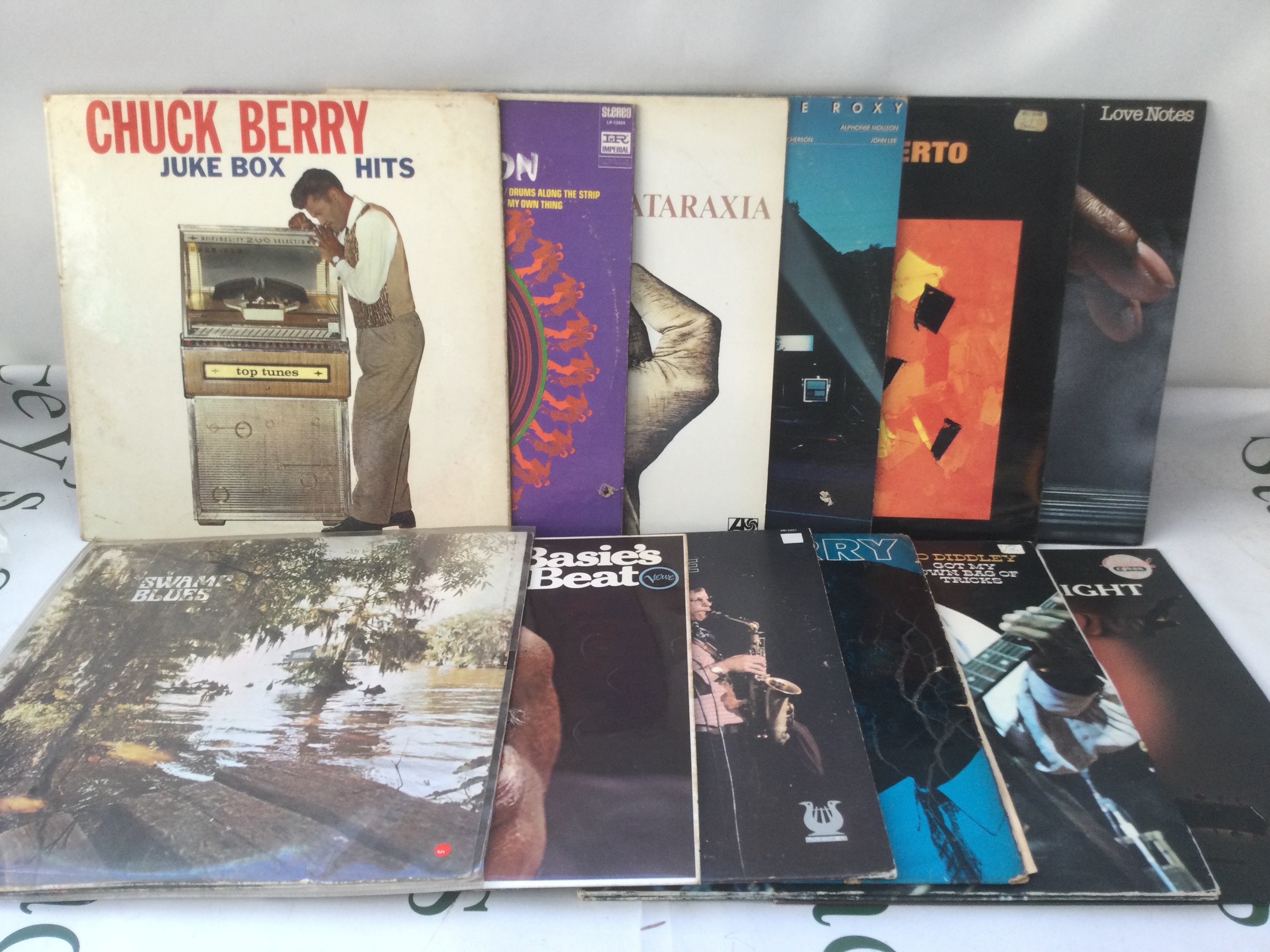 Twelve jazz, blues and rock n roll LPs by various artists including Stan Getz, Bo Diddley, Chuck Berry and others.