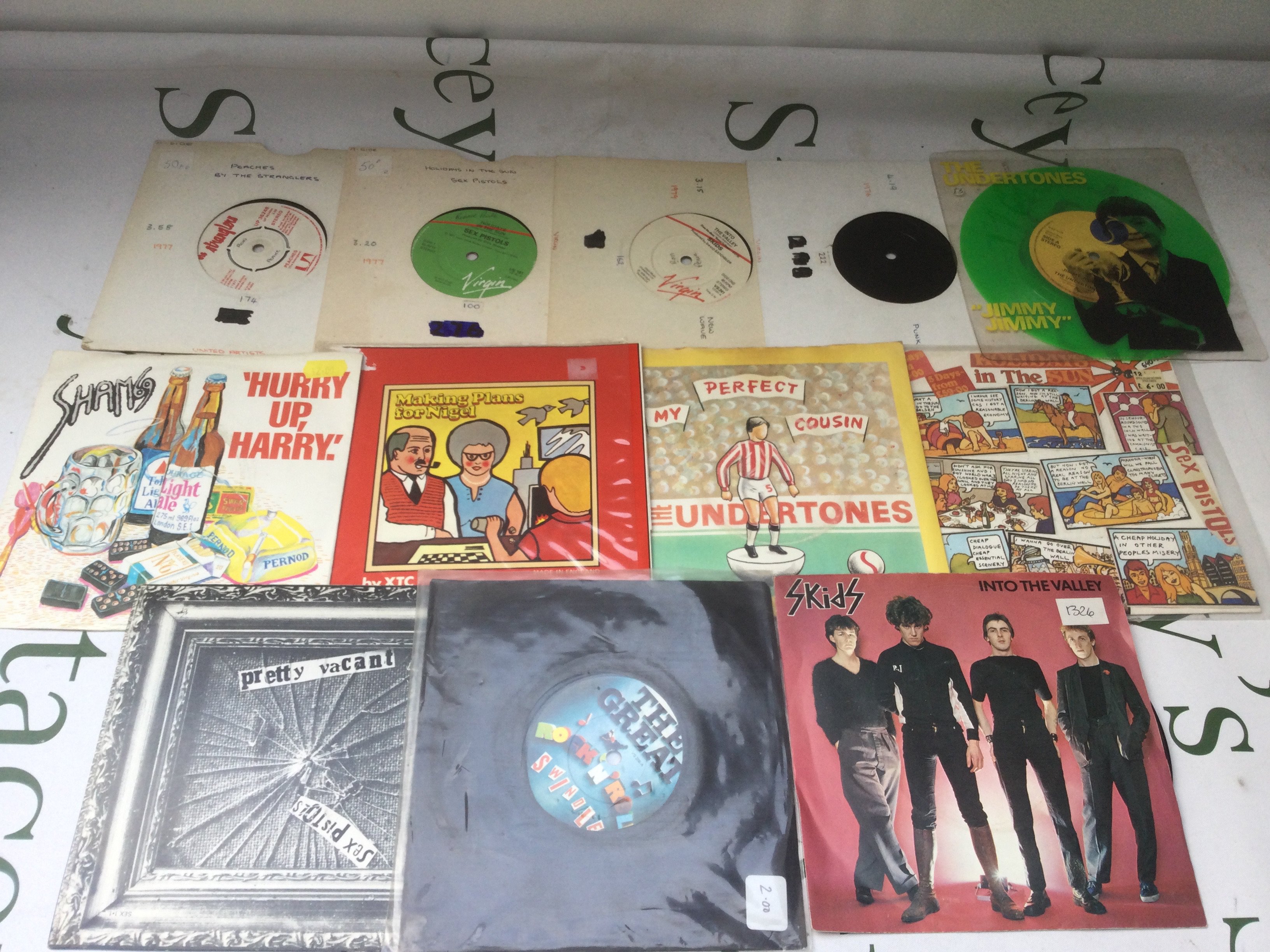 A collection of punk 7" singles by various artists including Sex Pistols, The Stranglers, Sham 69 and others.