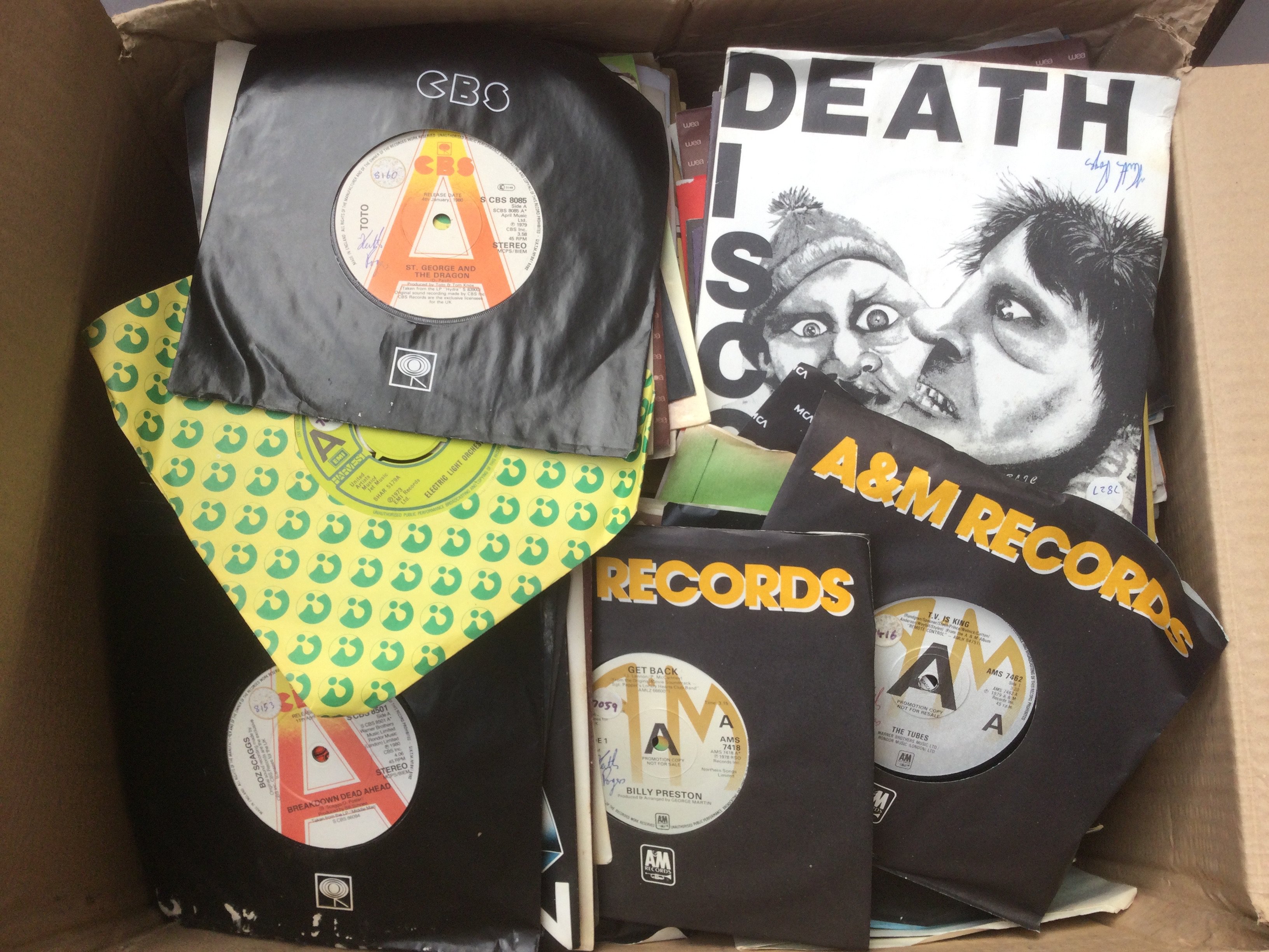 A box of 7" singles including many promo discs, various artists including PiL, The Tubes, Billy Preston and many more.