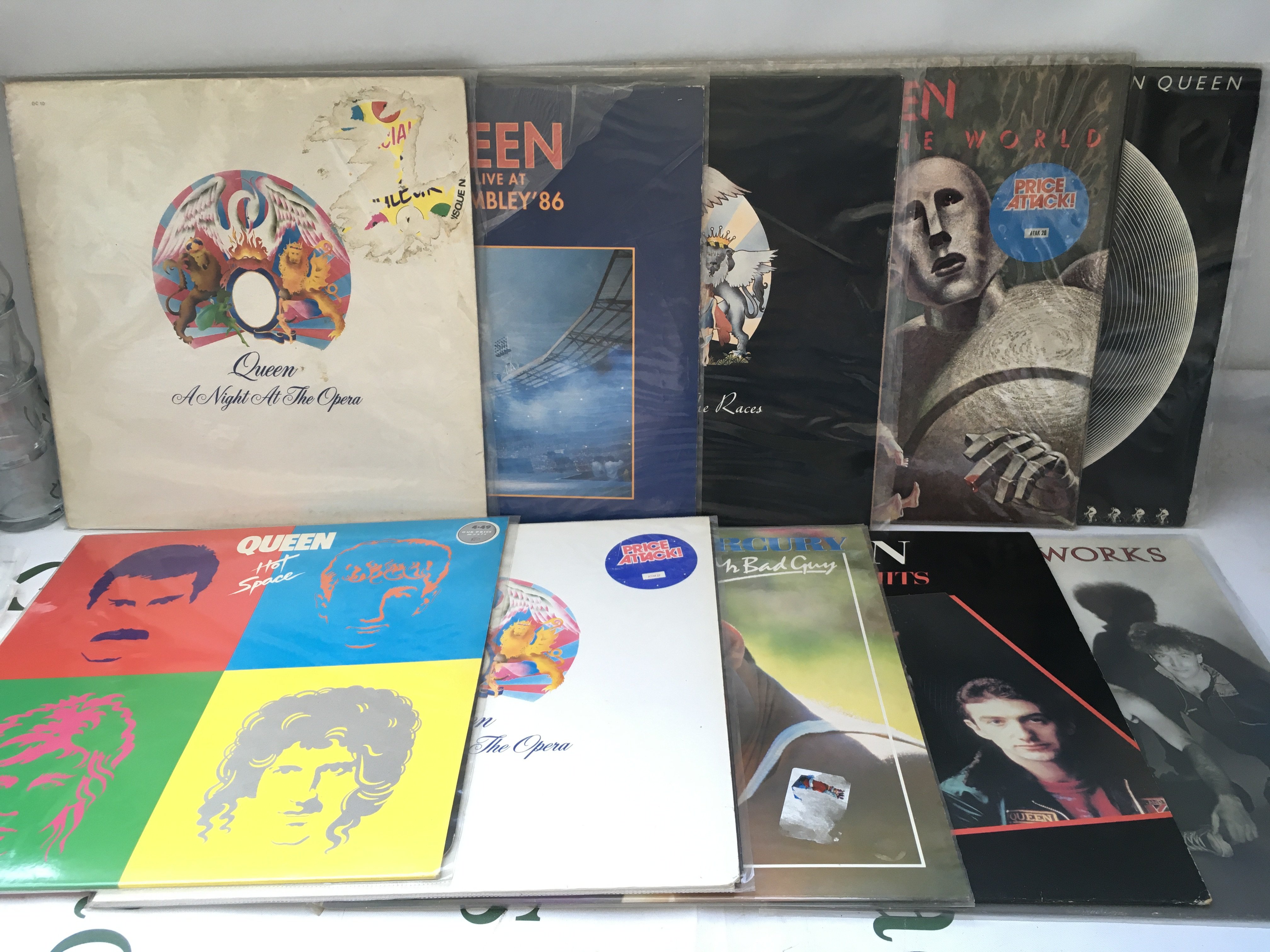 Ten Queen and related LPs including a white vinyl French pressing of A Night At The Opera, News Of The World, Hot Space and others.