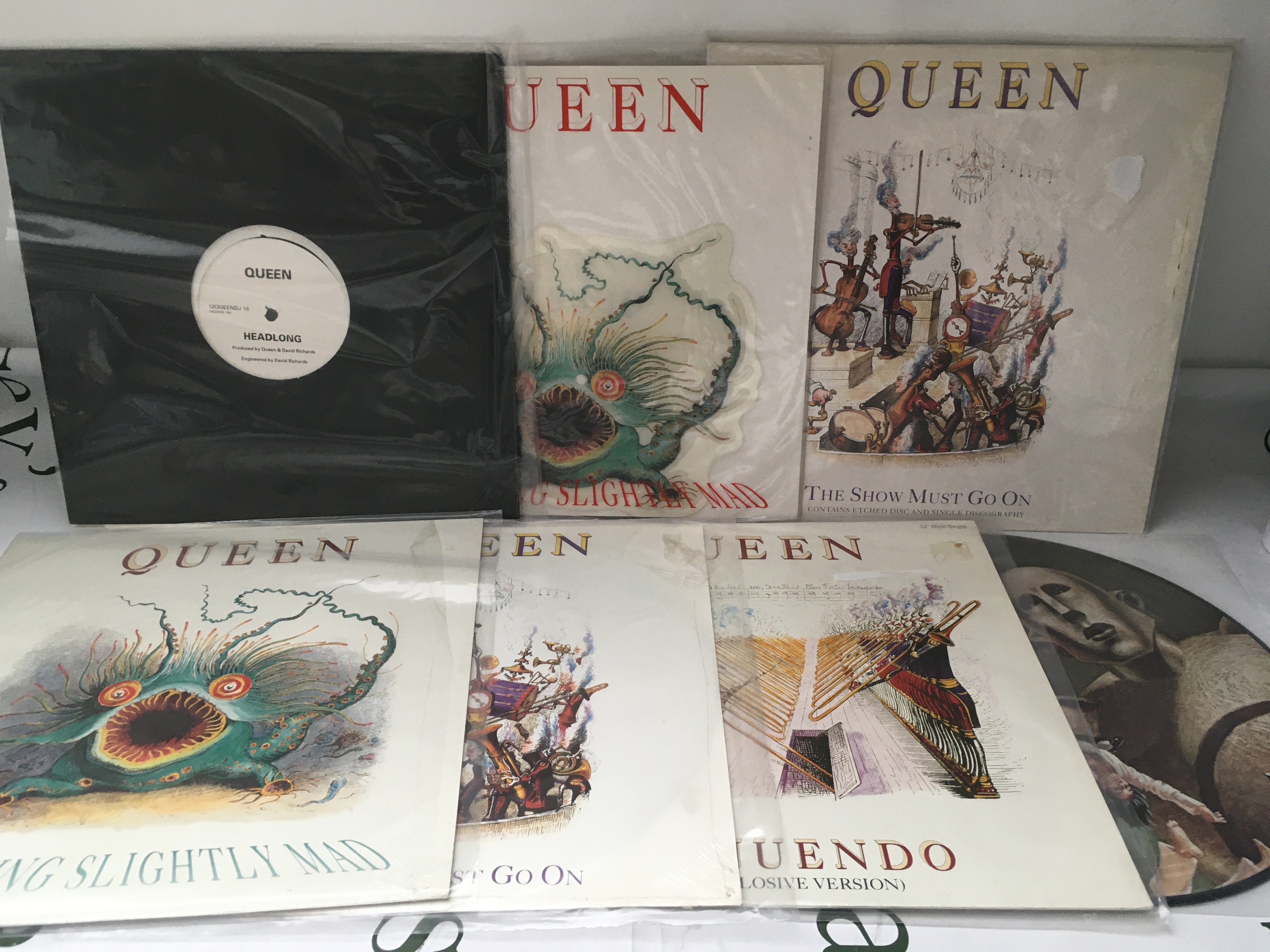Fifteen Queen 12" singles including a Headlong promo, The Show Must Go On etched disc, picture discs etc.