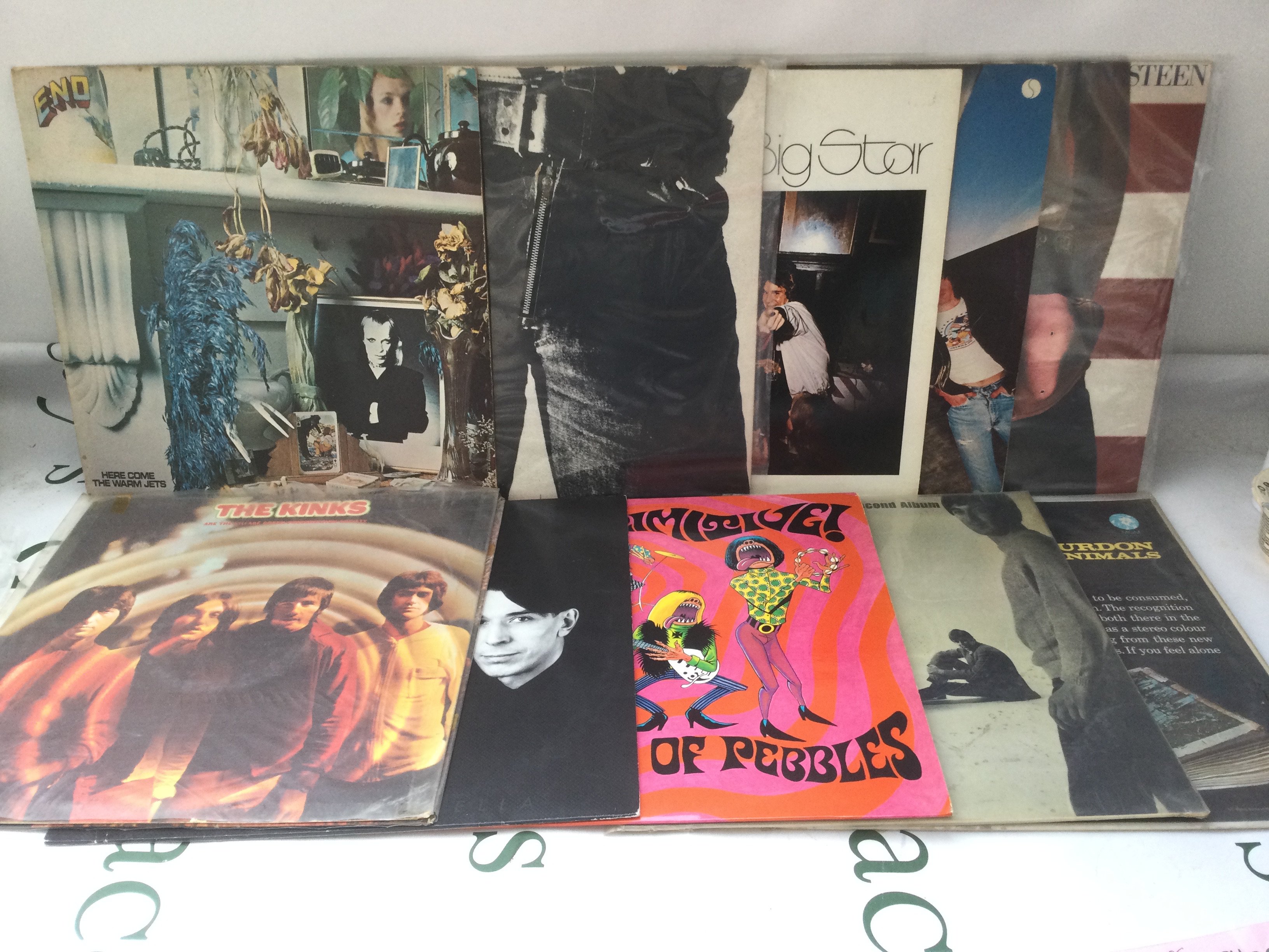 Two bags containing 21 rock and pop LPs and 12" singles by various artists including The Rolling Stones, The Kinks, The Ramones and others.