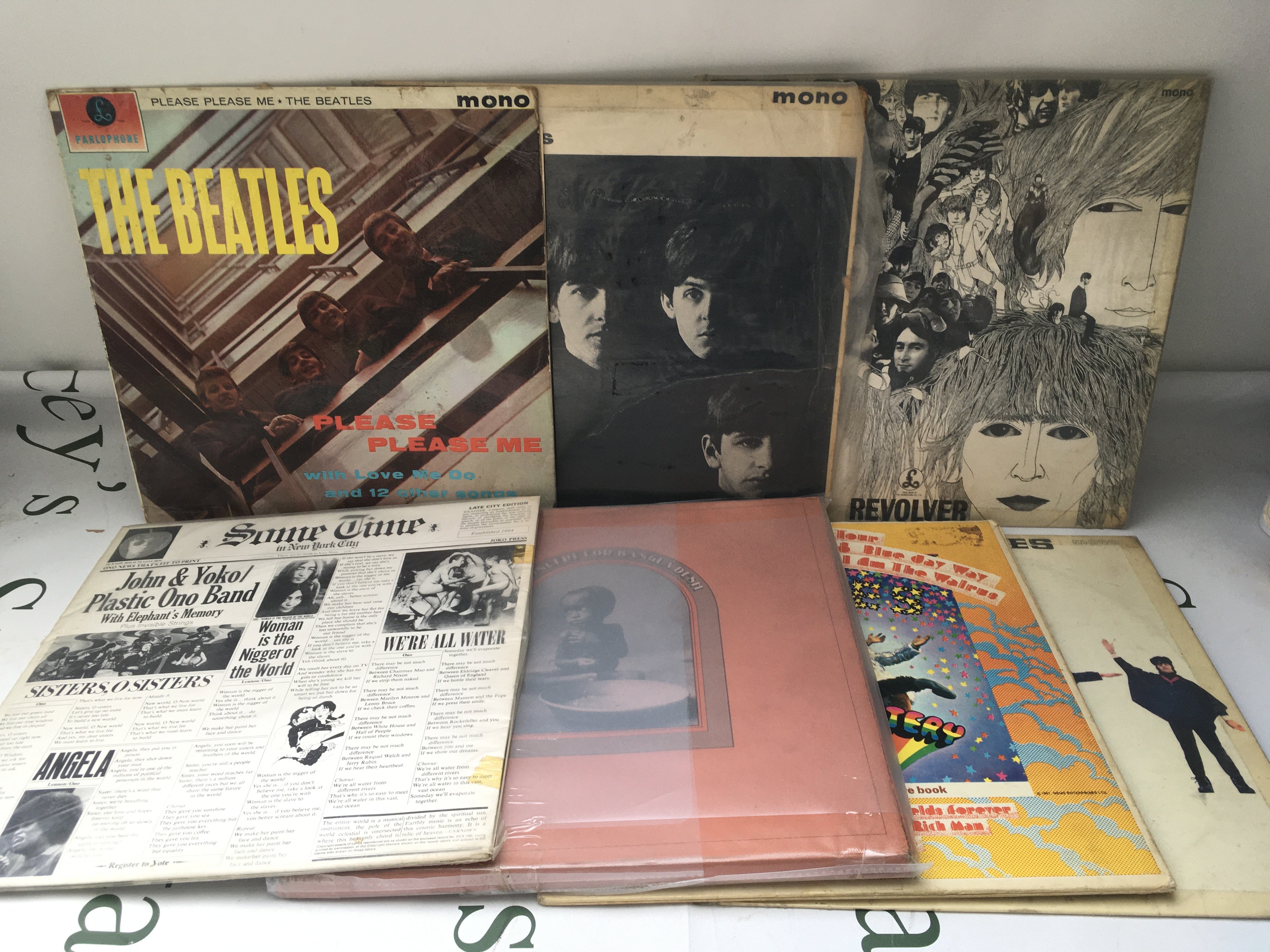 Seven Beatles and solo LPs comprising early UK mono pressings including Please Please Me (not black and gold labels), With The Beatles, Revolver and others plus a US pressing of Magical Mystery Tour etc.