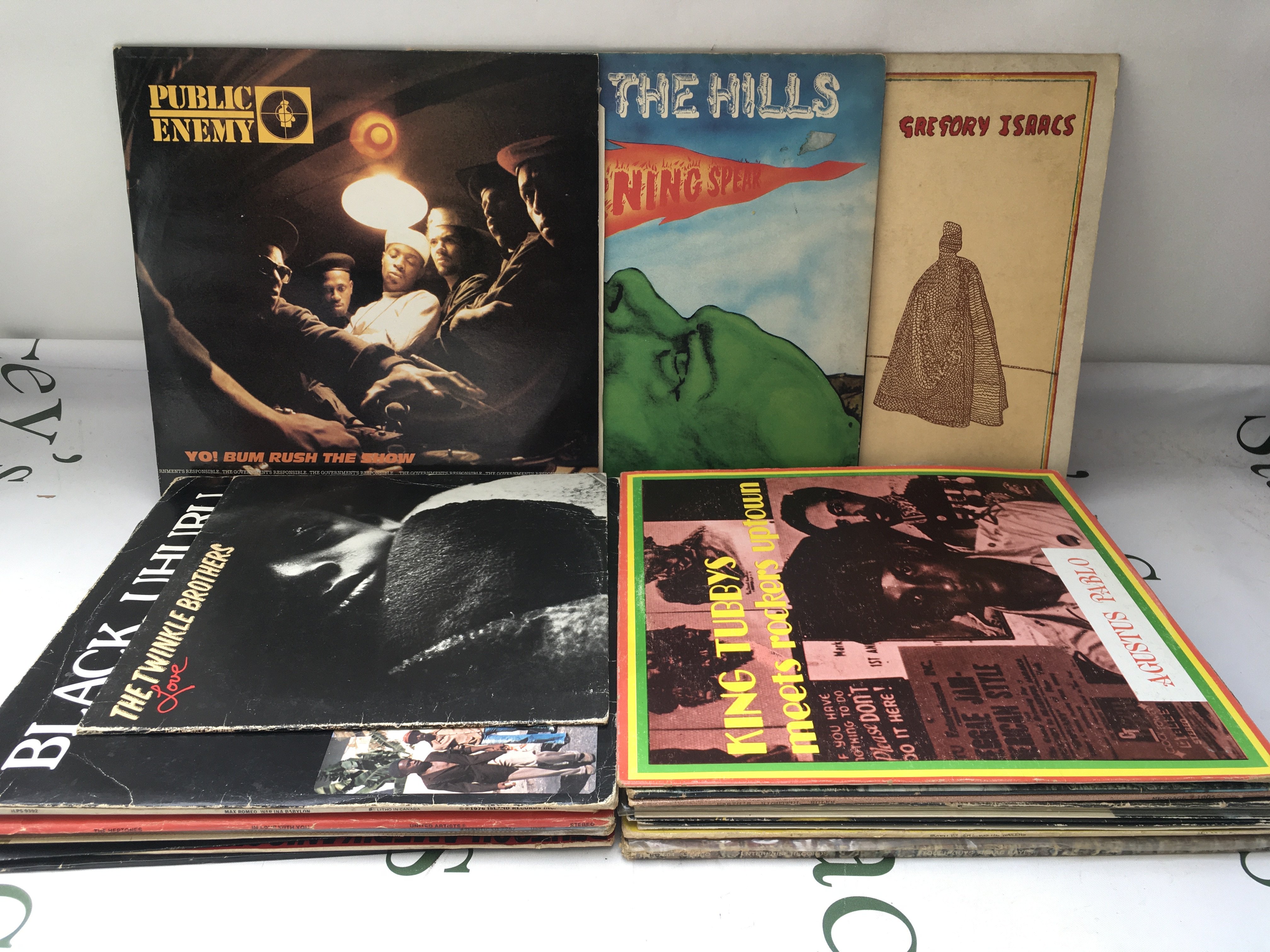 Two bags containing reggae, Hip Hop, jazz and funk LPs and 12" singles by various artists including Burning Spear, Augustus Pablo, Public Enemy and others.