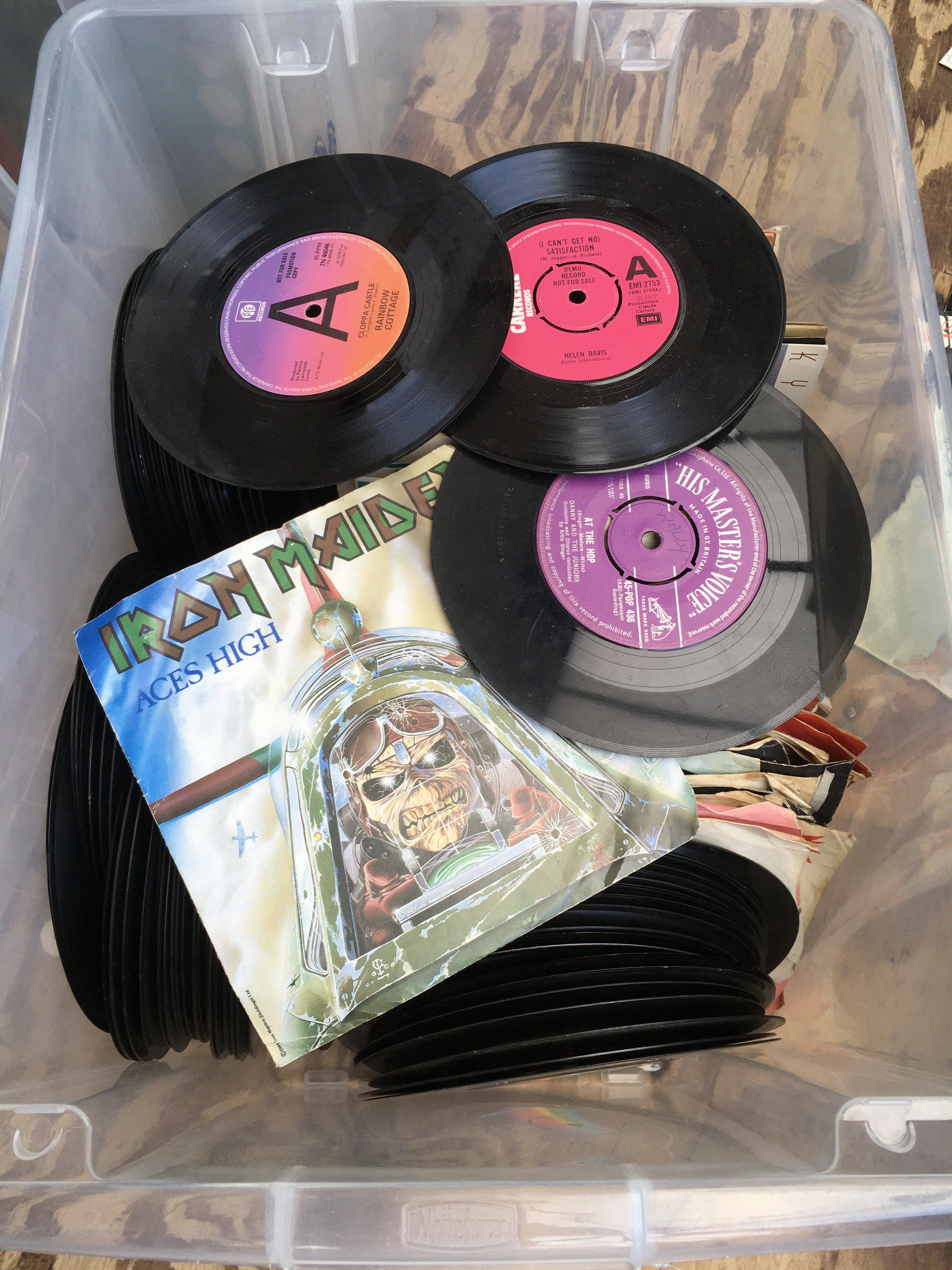Two boxes of 7" singles including some promo discs. Various artists including Iron Maiden, Kiss, Juicy Lucy and many more.