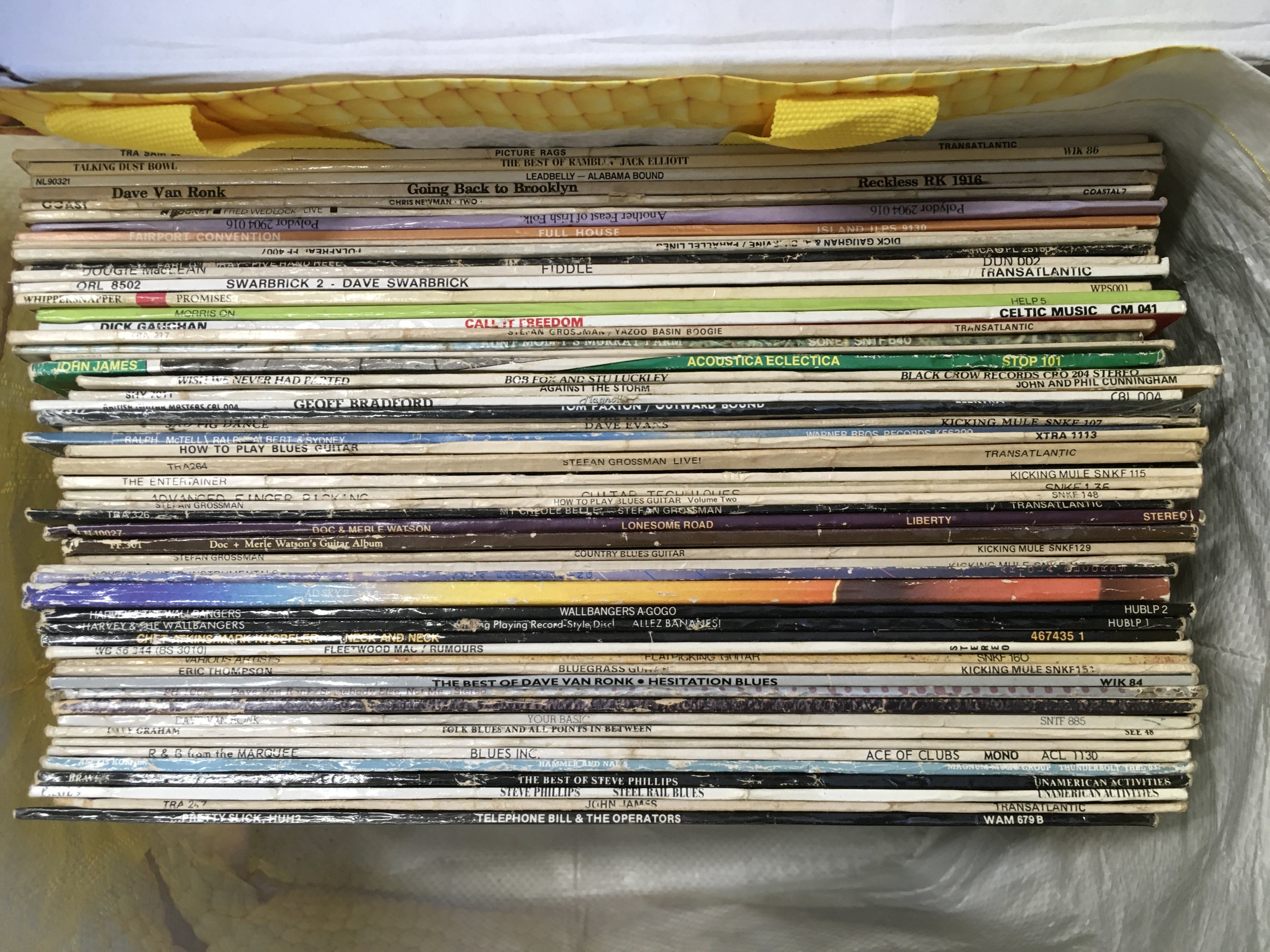 A bag of mainly folk and blues LPs by various artists including Dave Swarbrick, Tom Paxton, Leadbelly and others.