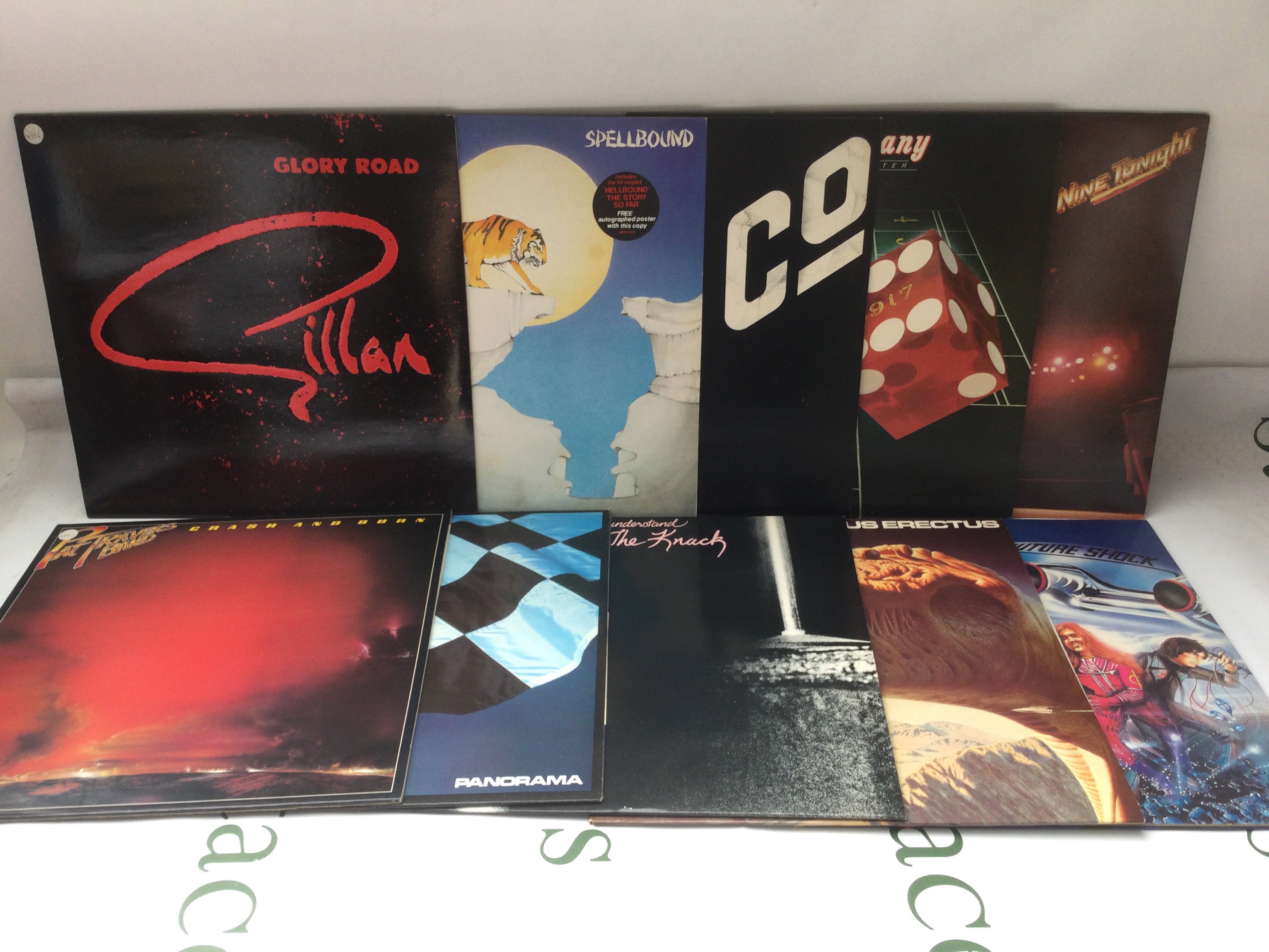 Two bags containing twenty rock LPs by various artists including Aerosmith, Blue Oyster Cult, Bad Company and others. Includes three promo discs.