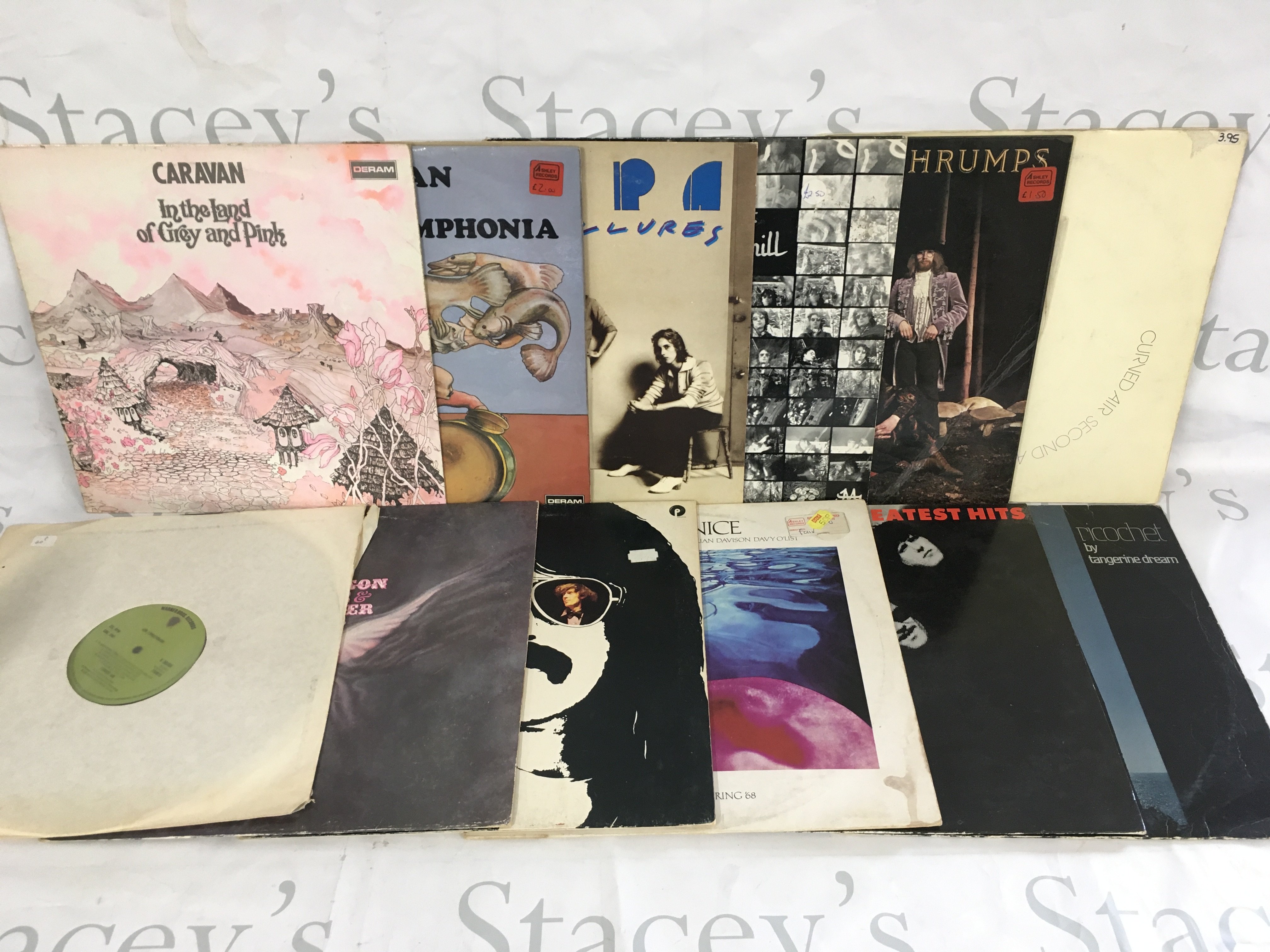 12 prog rock LPs by various artists including Caravan, Frank Zappa, The Nice and others.