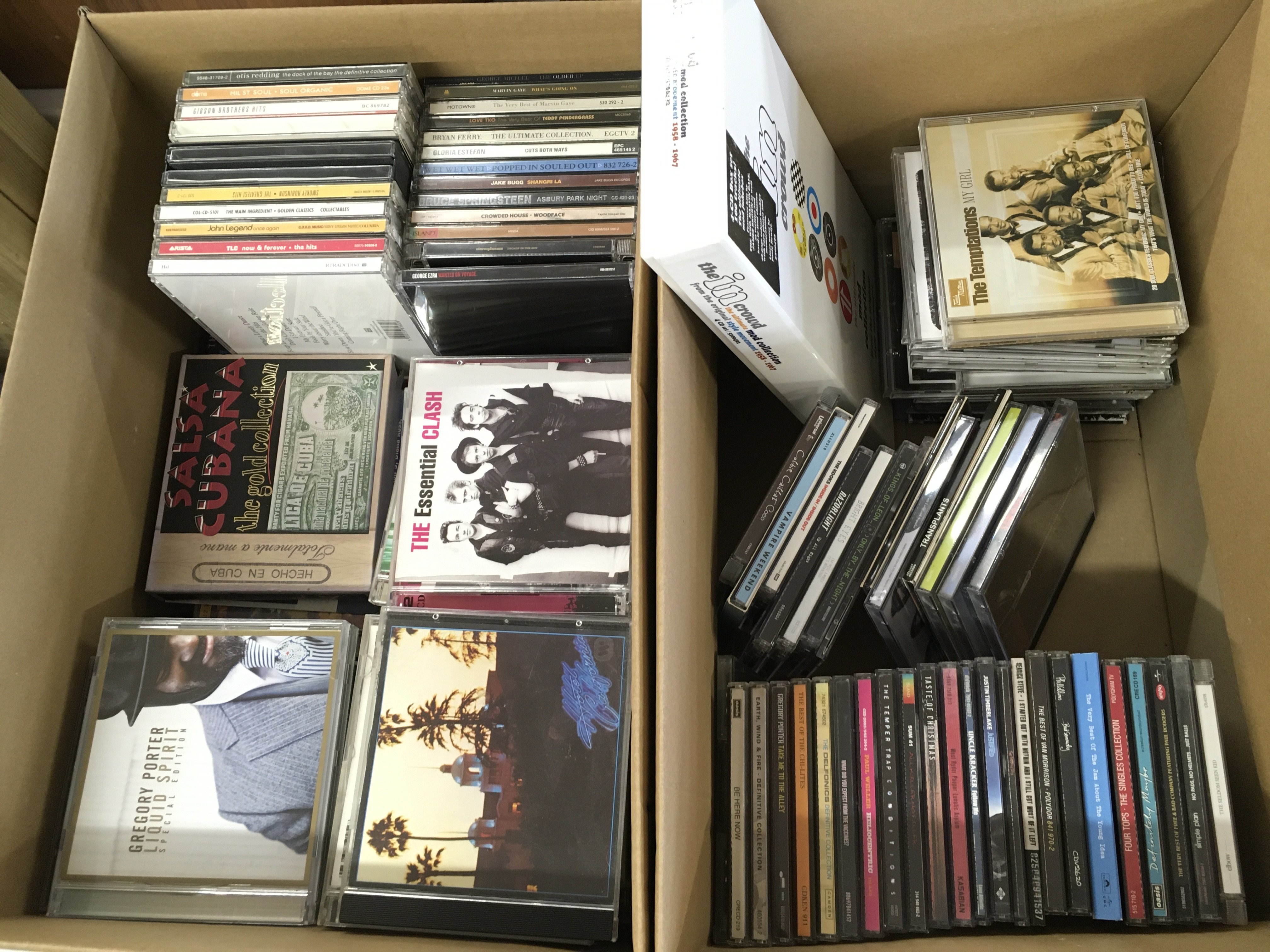 Four boxes of CDs and DVDs.